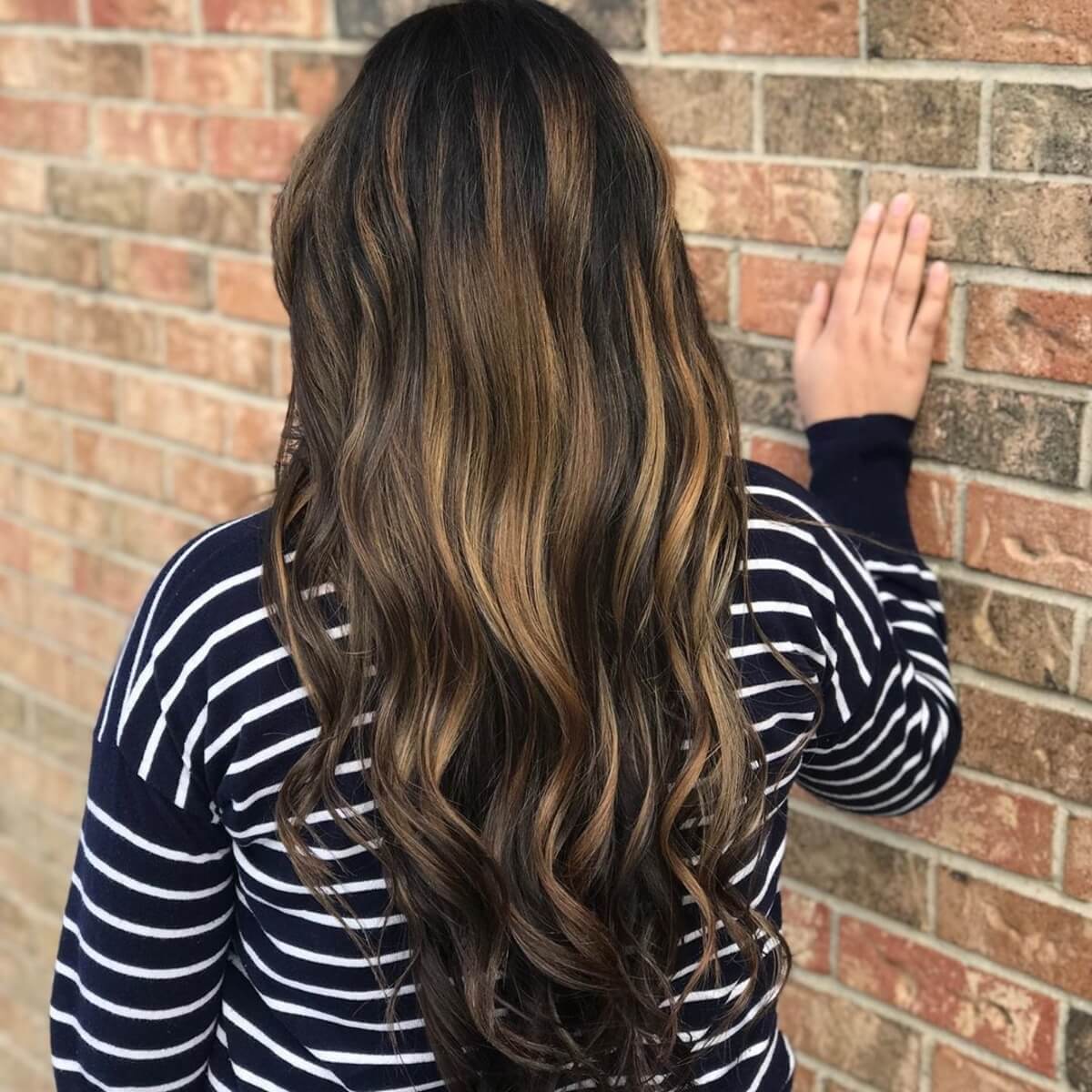 dark brown hair with blonde and caramel highlights