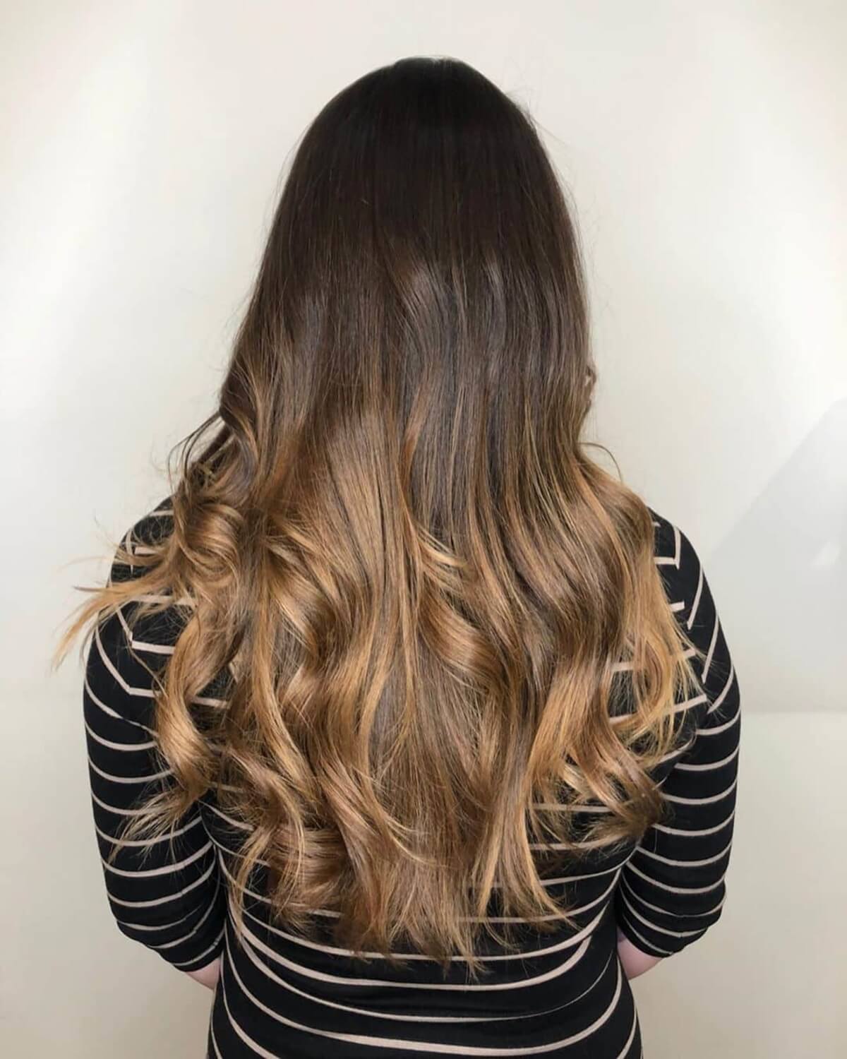 dark brown hair with caramel ombre highlights