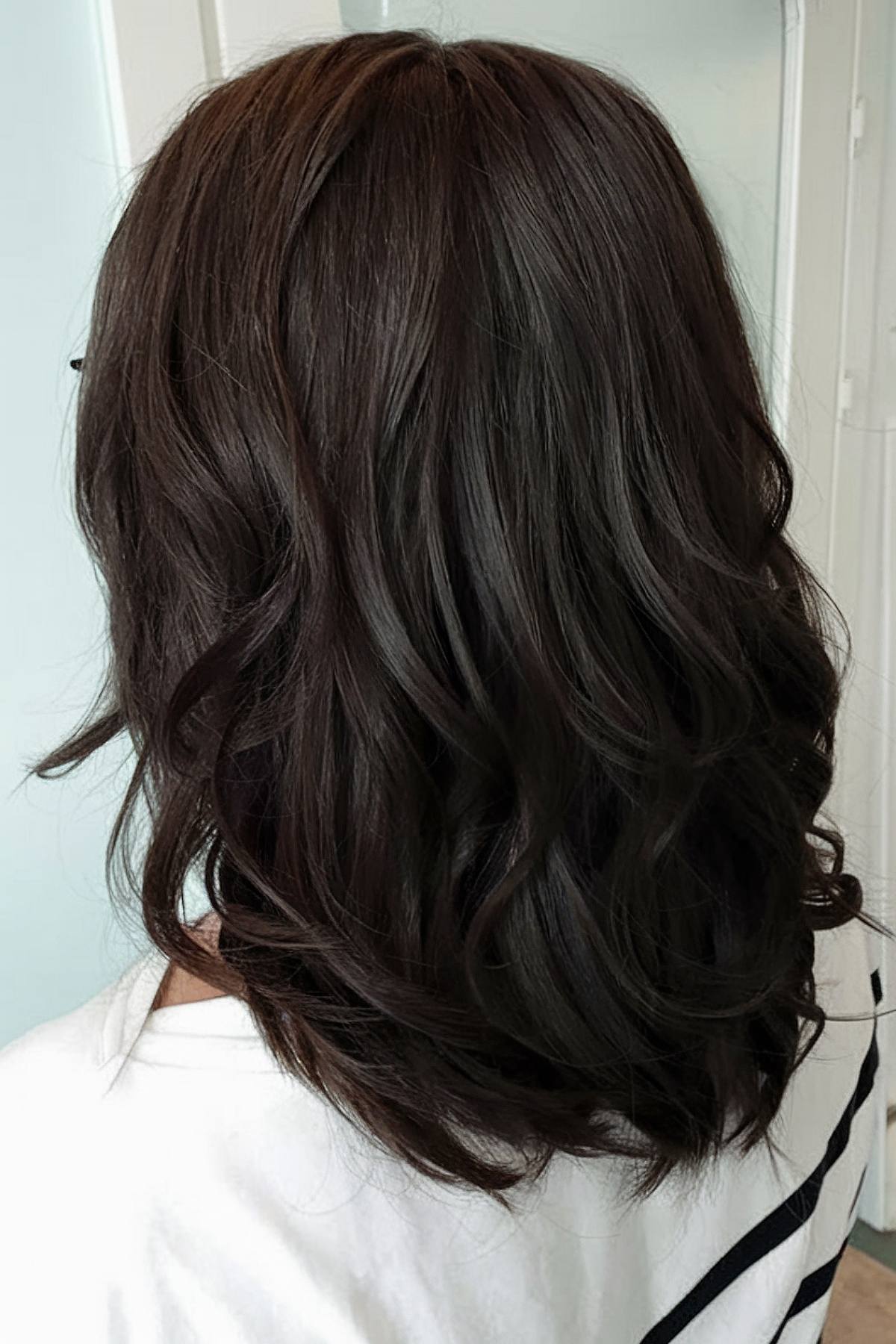 Dark brown hair with soft waves