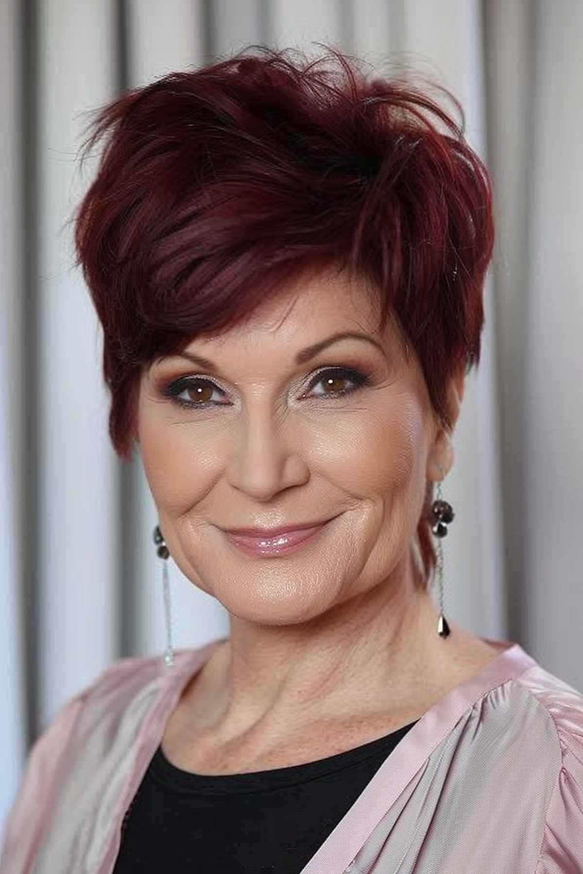 Short layered cut with dark cherry color for women over 50.