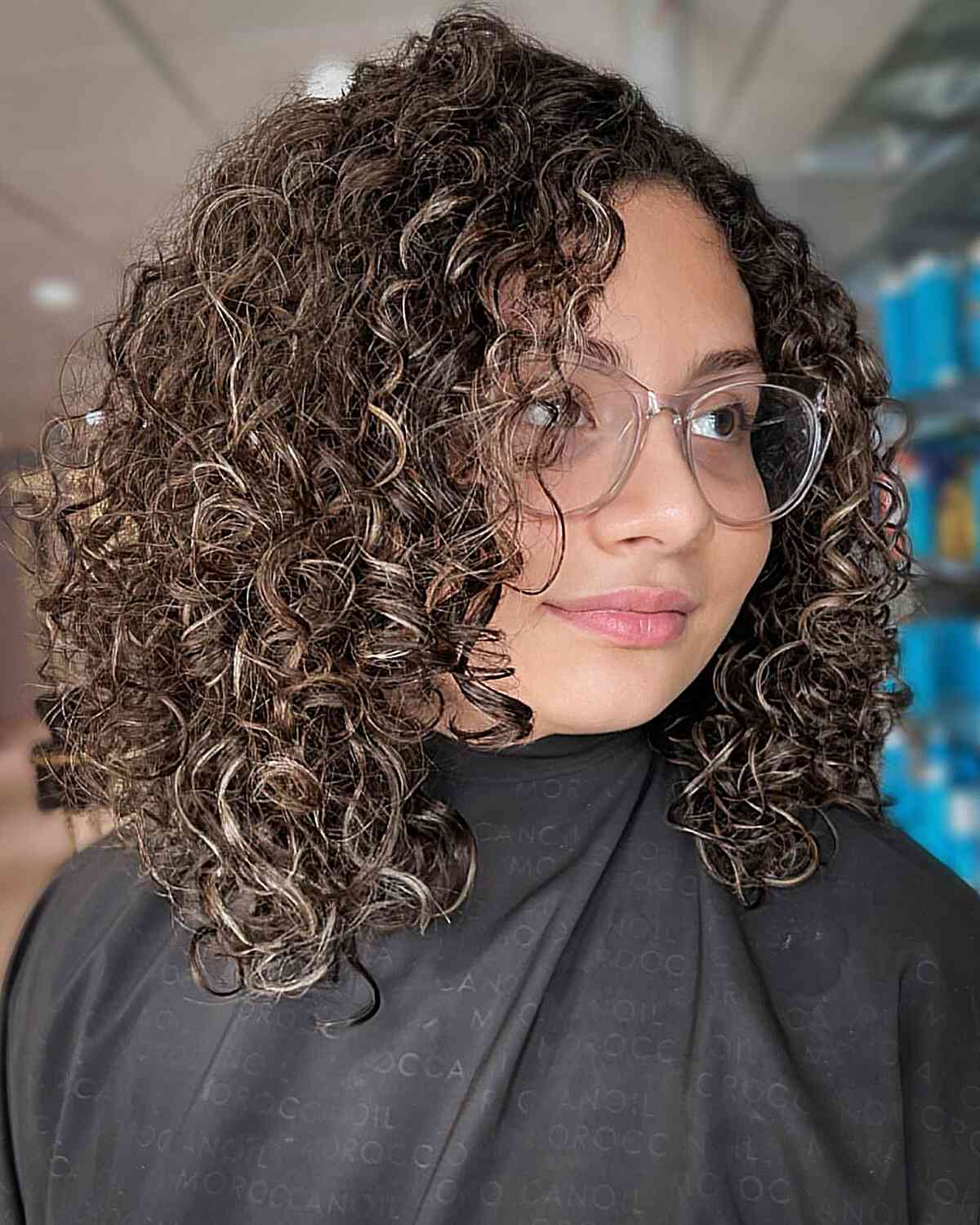 Dark Curls with Hints of Blonde Balayage for Curly Hair