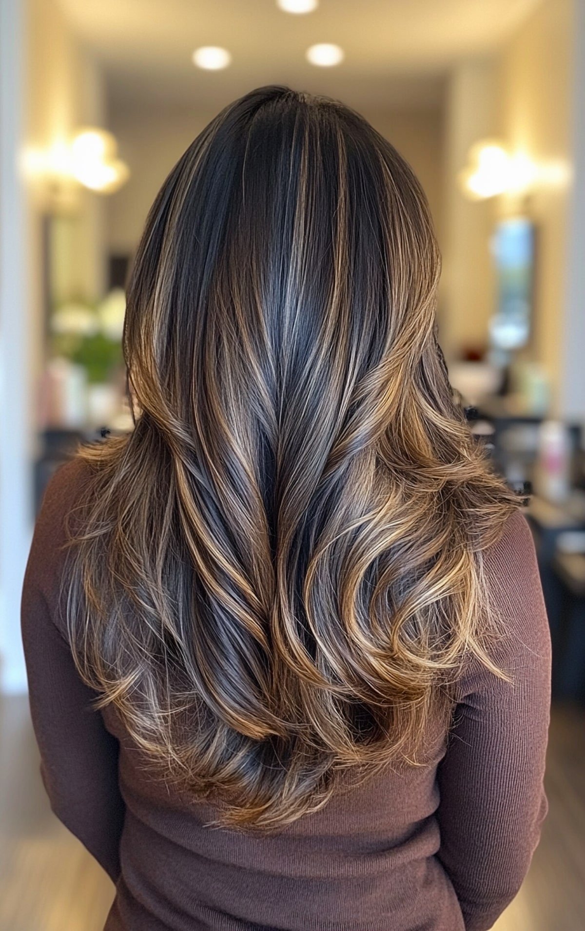 Dark espresso hair color with caramel highlights for long layered hair