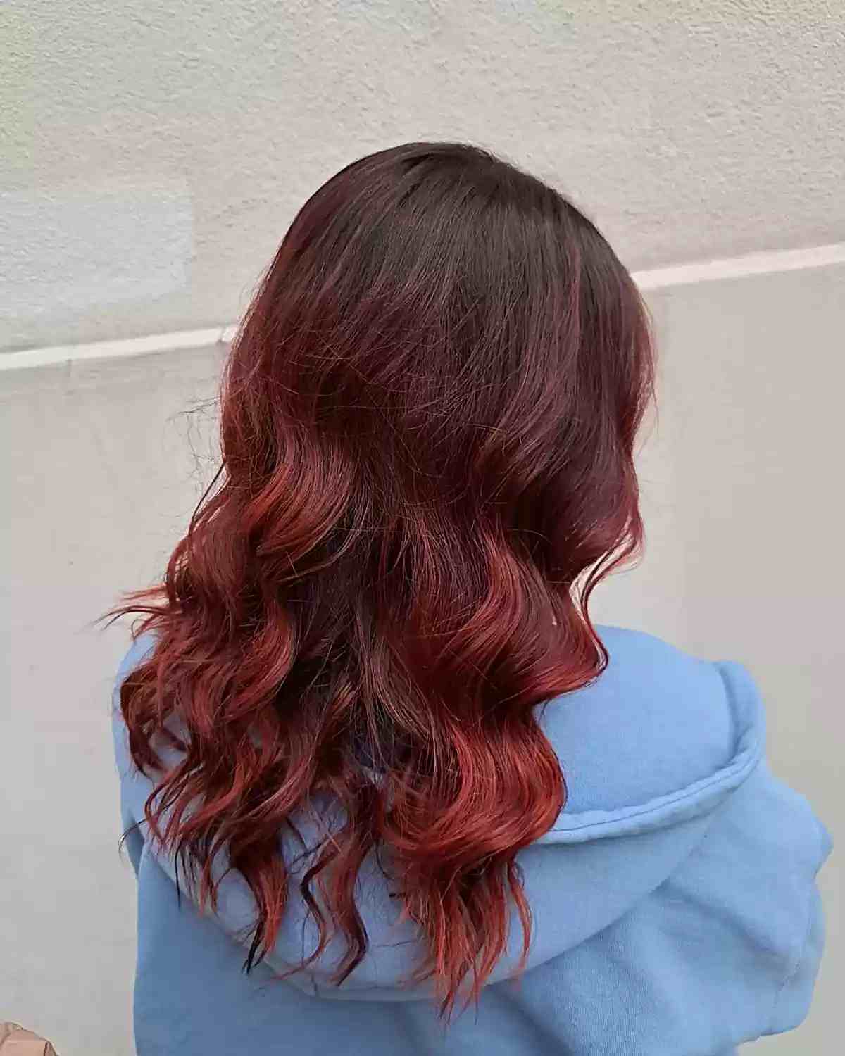 Low-Maintenance Dark Flaming Red Color Melt Balayage with Medium Waves on Brown Hair