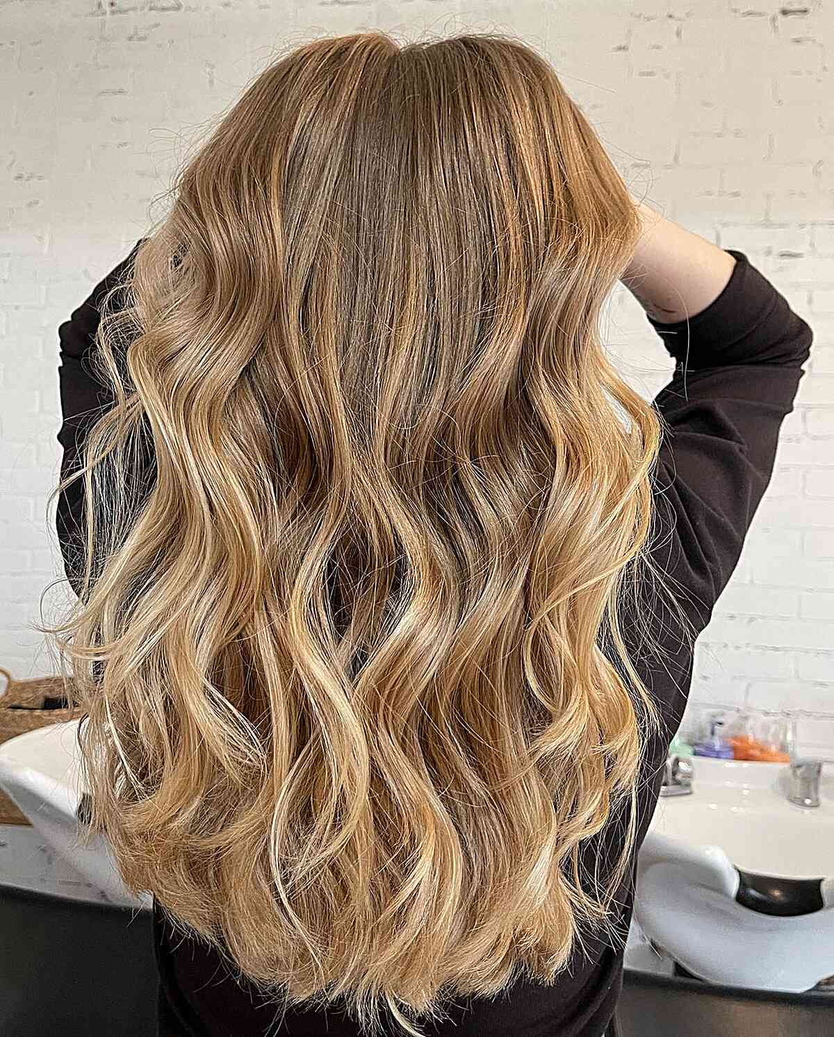 Dark Honey Blonde Ombre Balayage with Long Waves