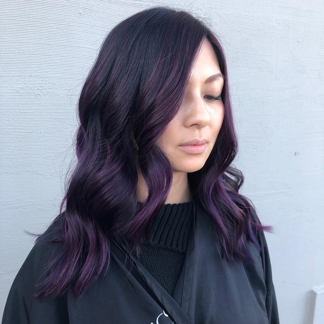 Amazing dark purple highlights on black hair