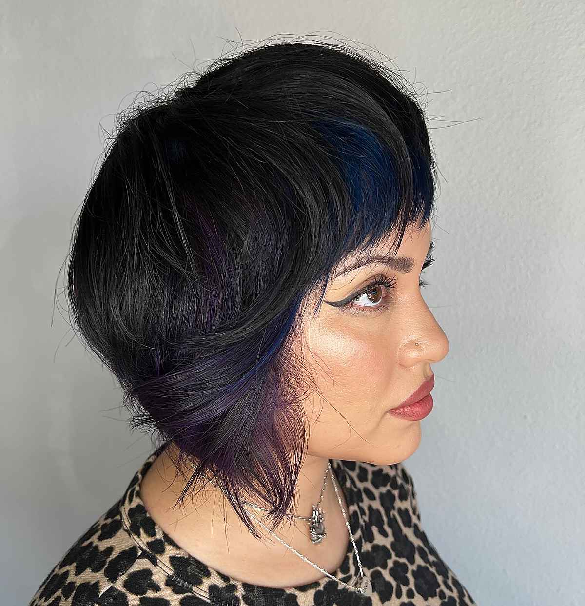 dark purple peekaboo highlights on medium brown hair