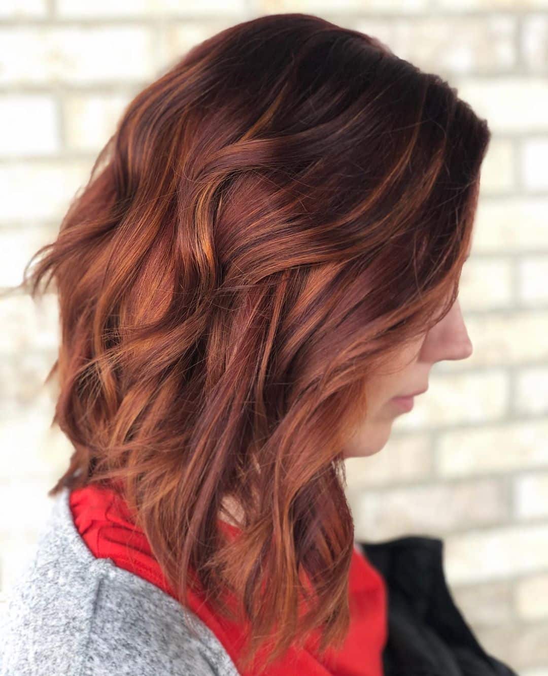 Shoulder-Length Dark Red Hair with Copper Highlights