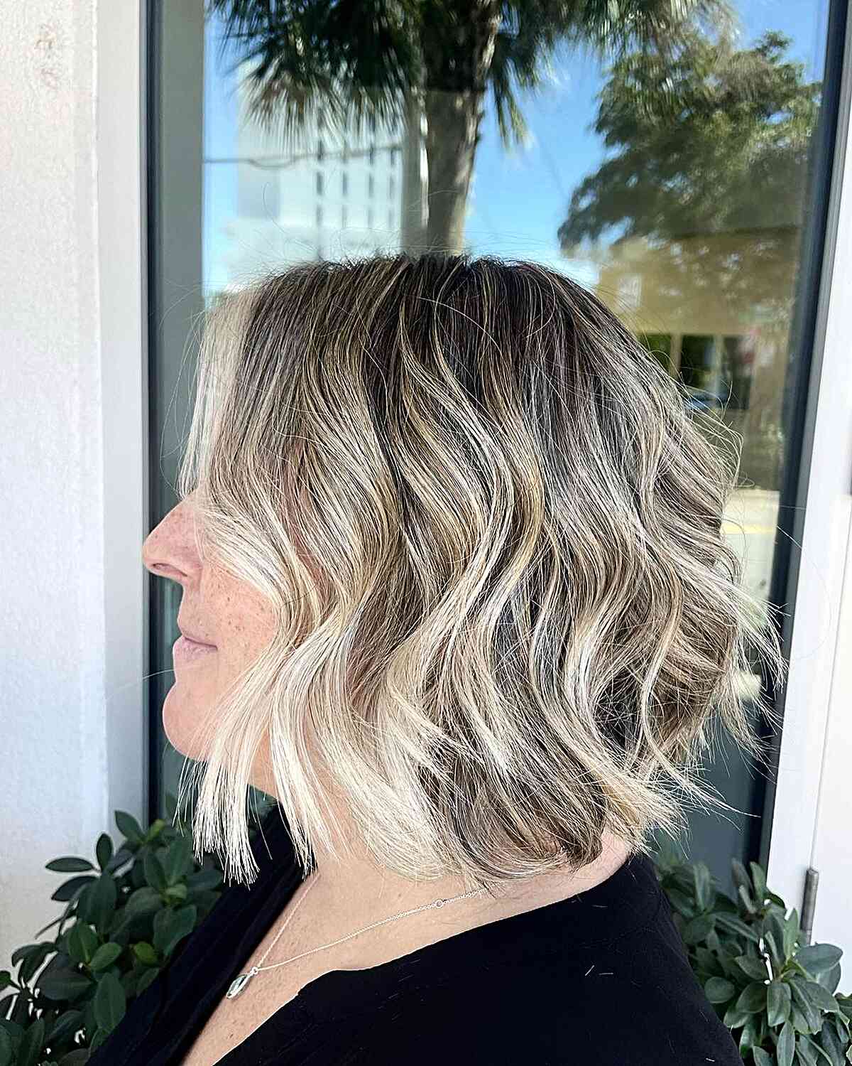 Dark-Rooted Icy Balayage Short Bob with Money Piece