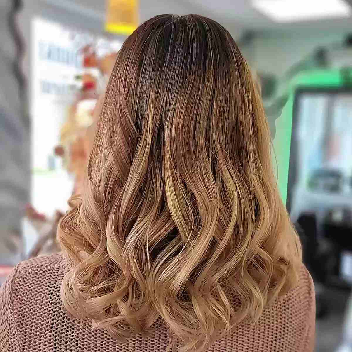 Dark-Rooted Warm Strawberry Blonde Balayage for Mid-Length Haircut