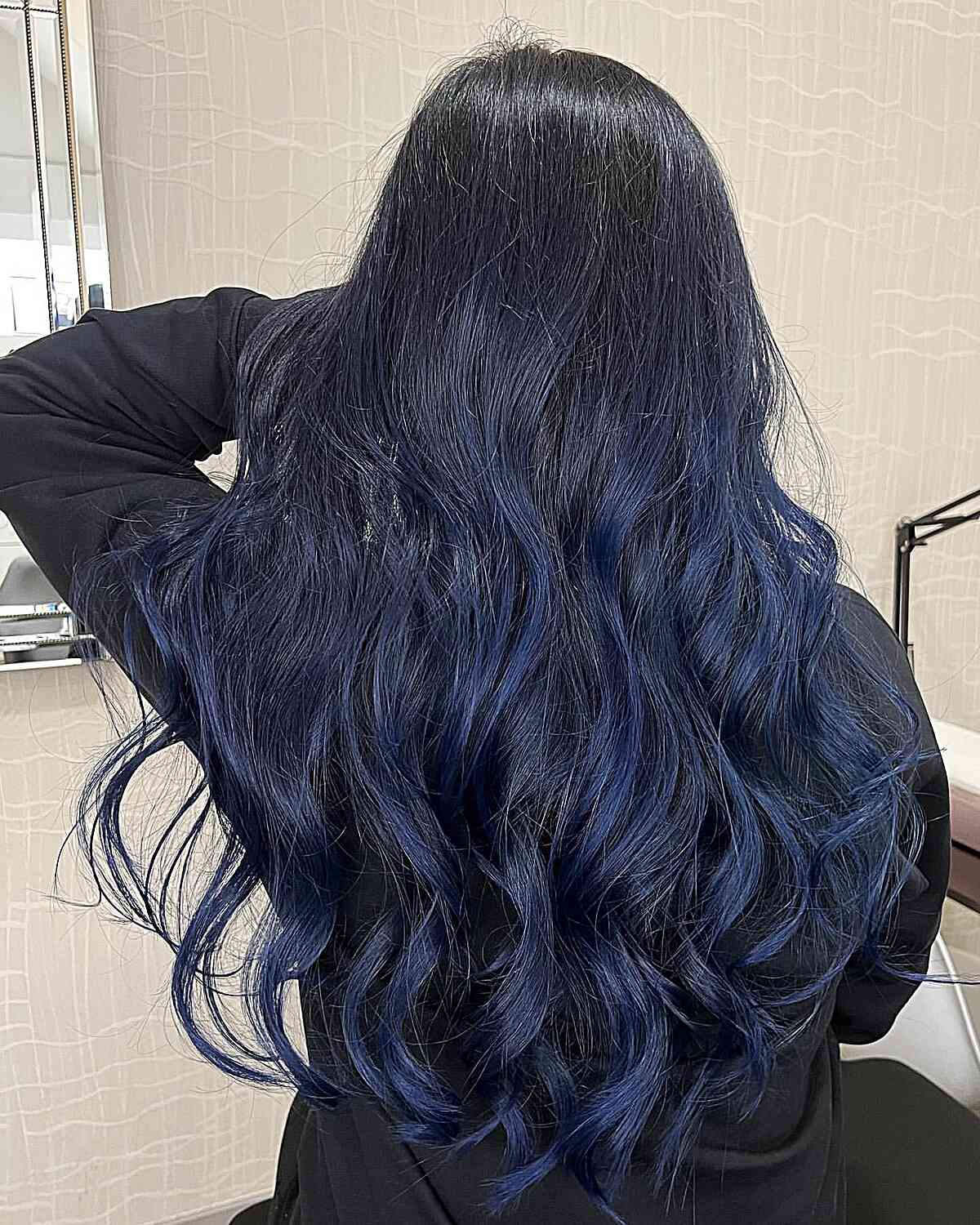 Deep Blue Balayage Streaks for Long-Length Black Hair with Soft Waves