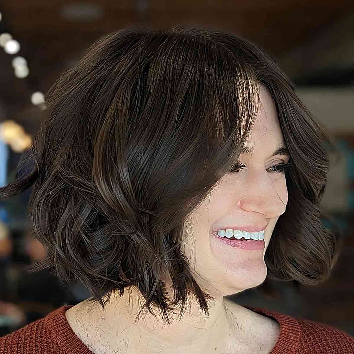 Deep Brown Bob with Subtle Highlights and Voluminous Waves