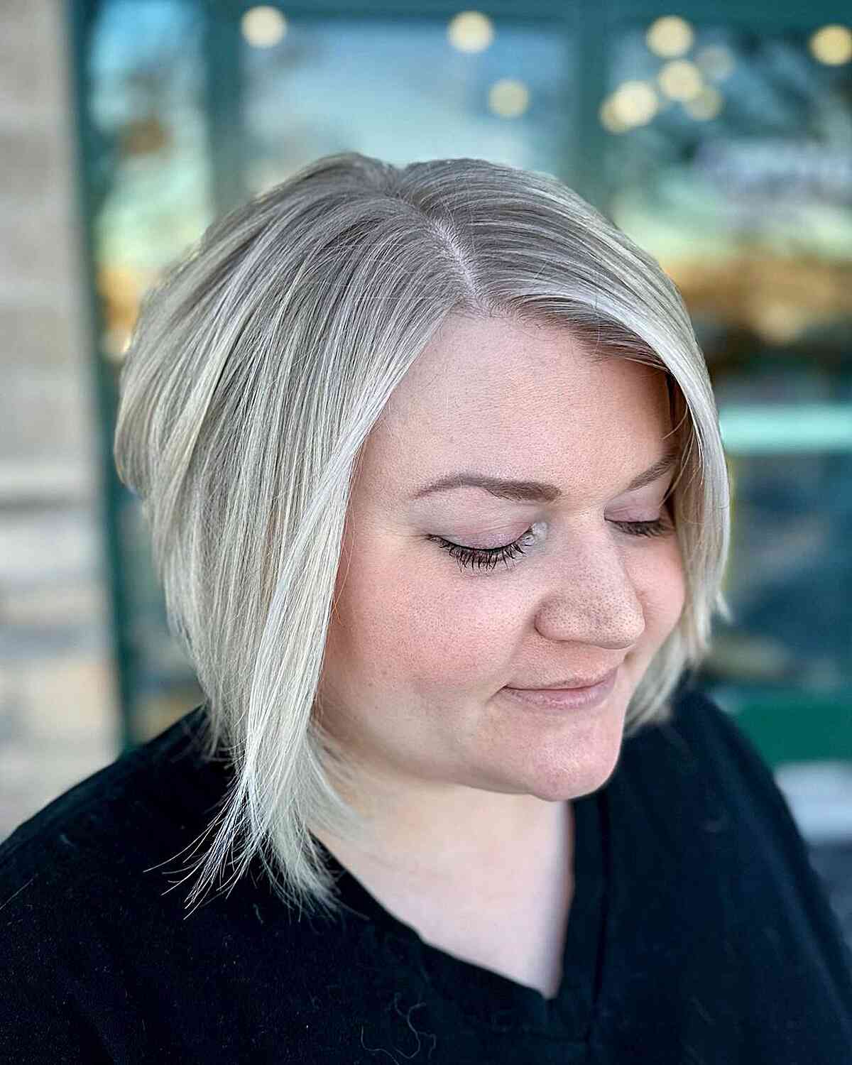 Deep Side Part Bob and Icy Blonde Color for Fine-Haired Women with Round Faces