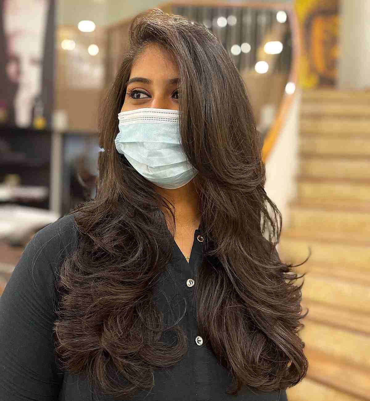 Deep Side Part Hair with Long Feathery Layers