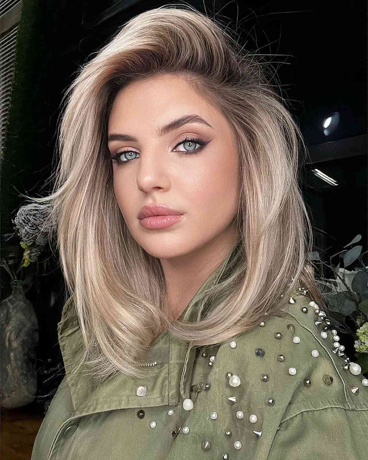 Deeply Side Parted Blonde Hair with Volume