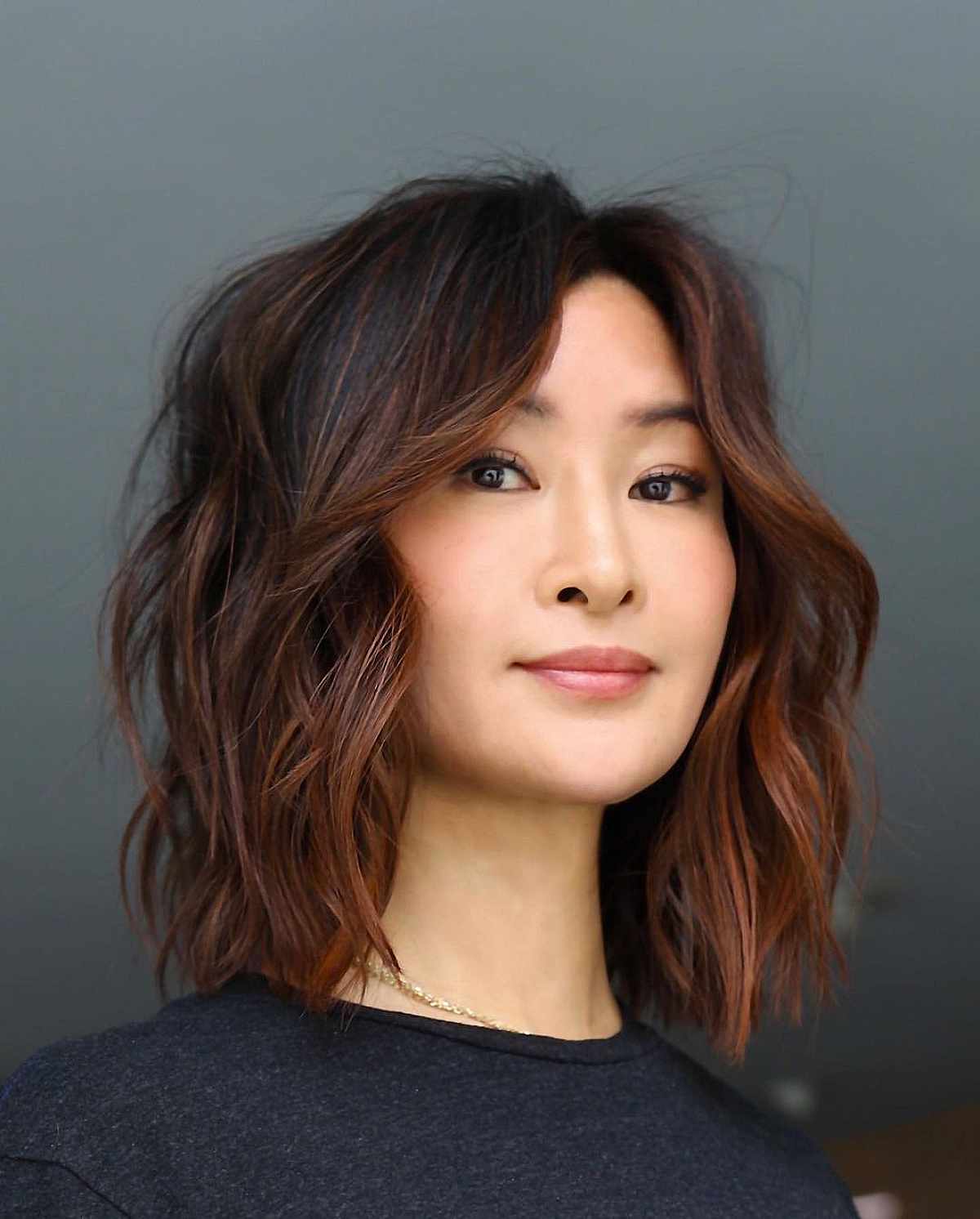 Defined texturized shoulder length lob haircut for thick hair