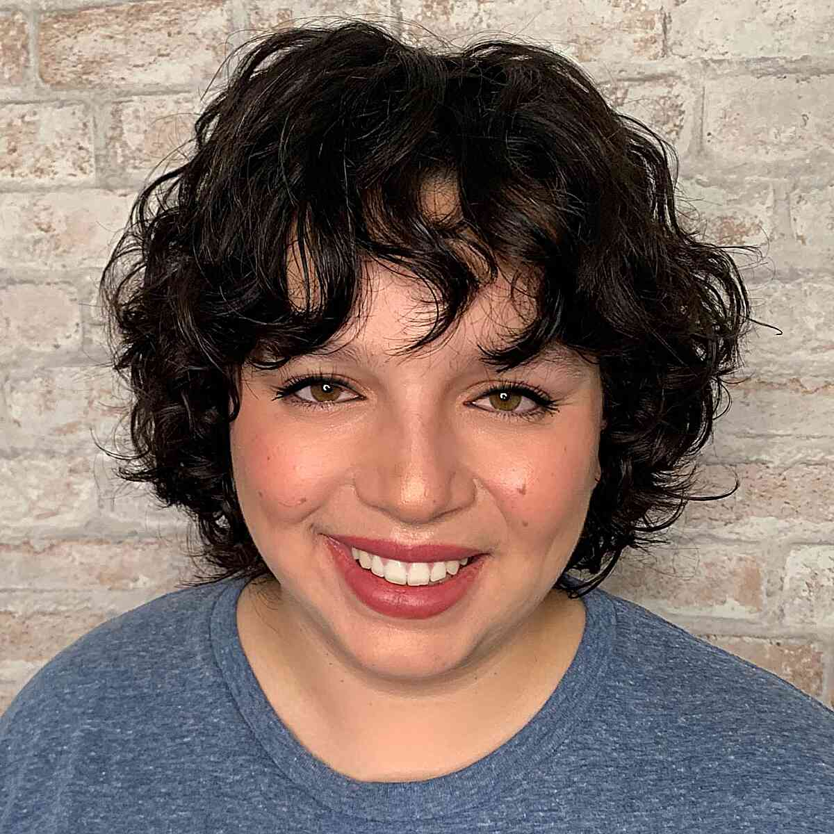 Deva Cut-Inspired Curly Short Hair for Round Face Shapes with choppy bangs
