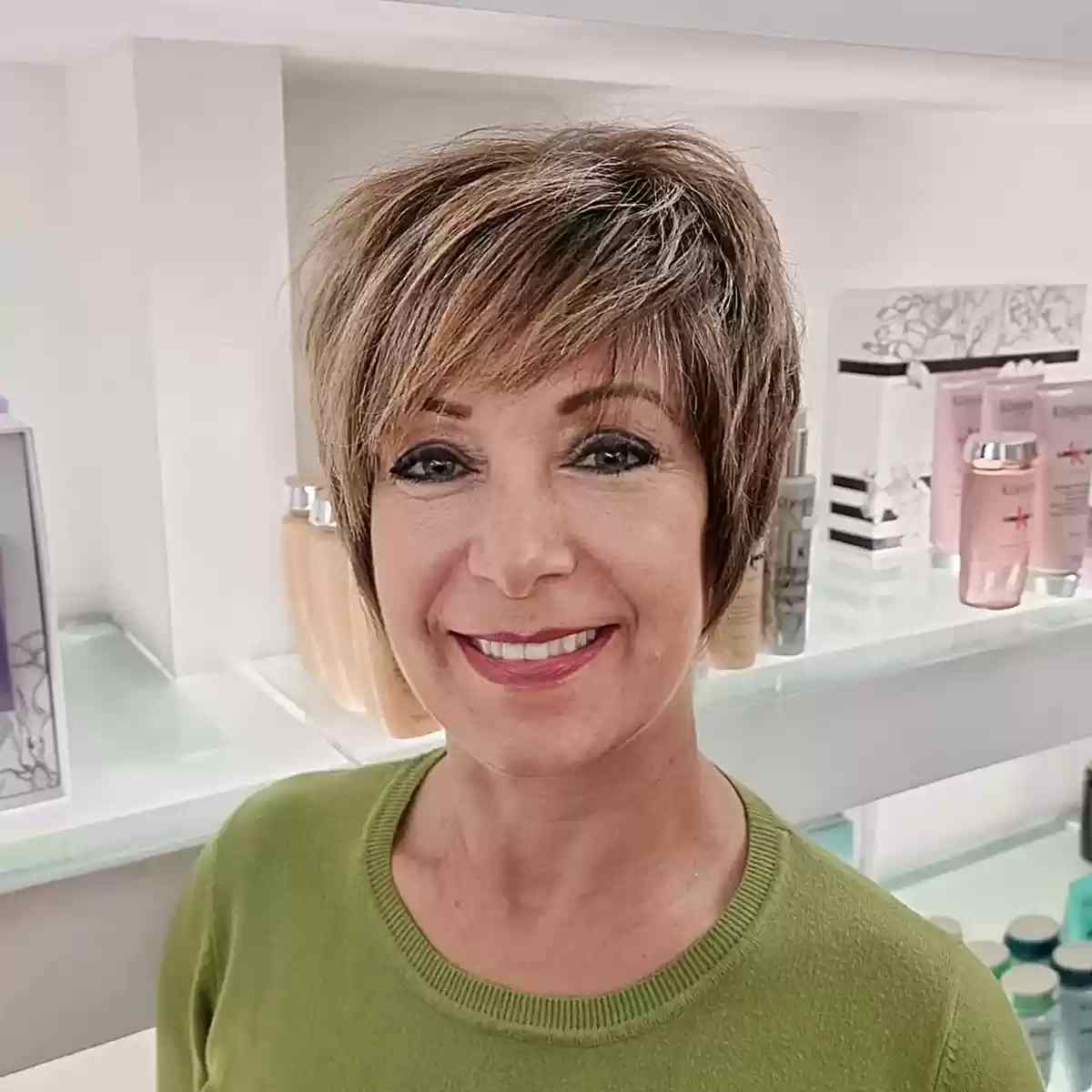 Dimensional Long Choppy Pixie with Side-Swept Bangs for Ladies Aged 70 with Long Faces