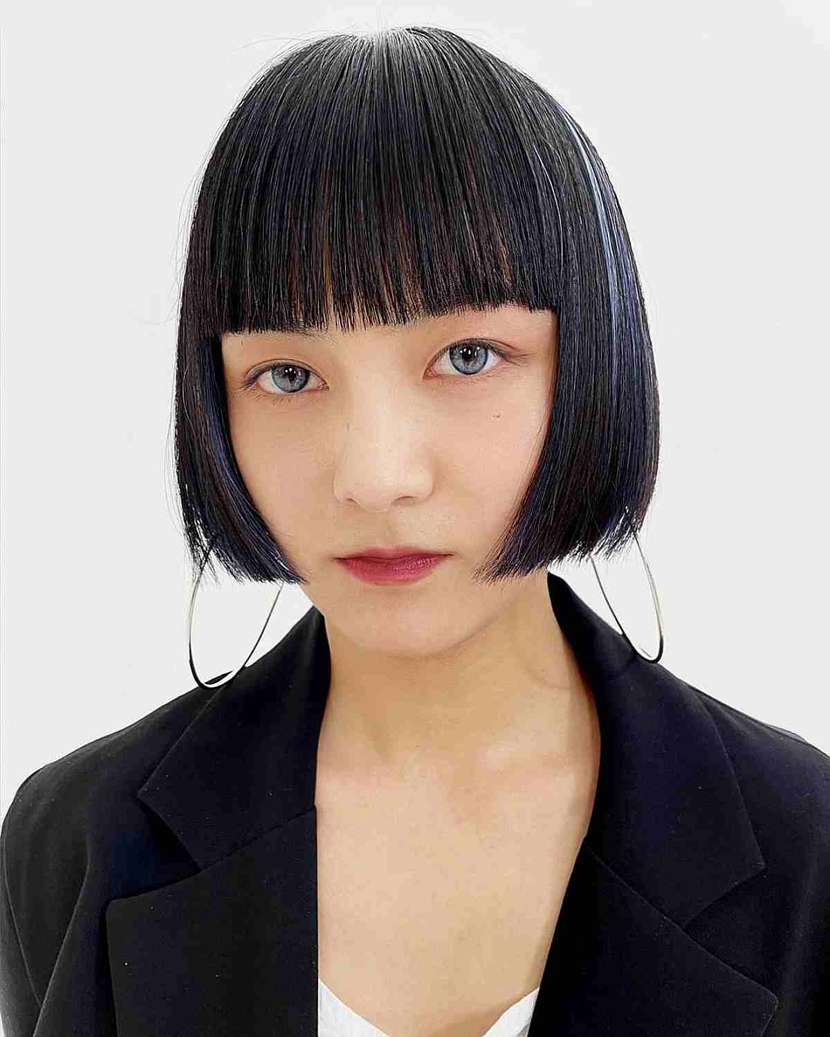 Disconnected One-Length Bob with Full Bangs at the Jawline