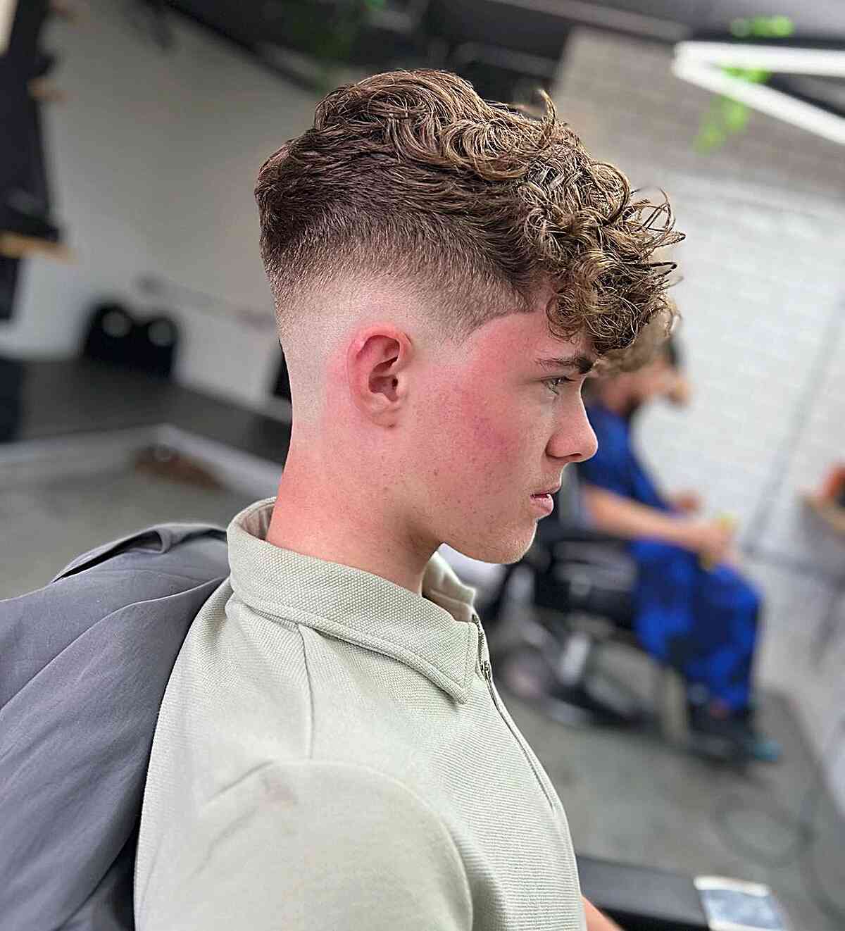 Drop Fade with a Long Messy Top and Textured Fringe for Teen Boys