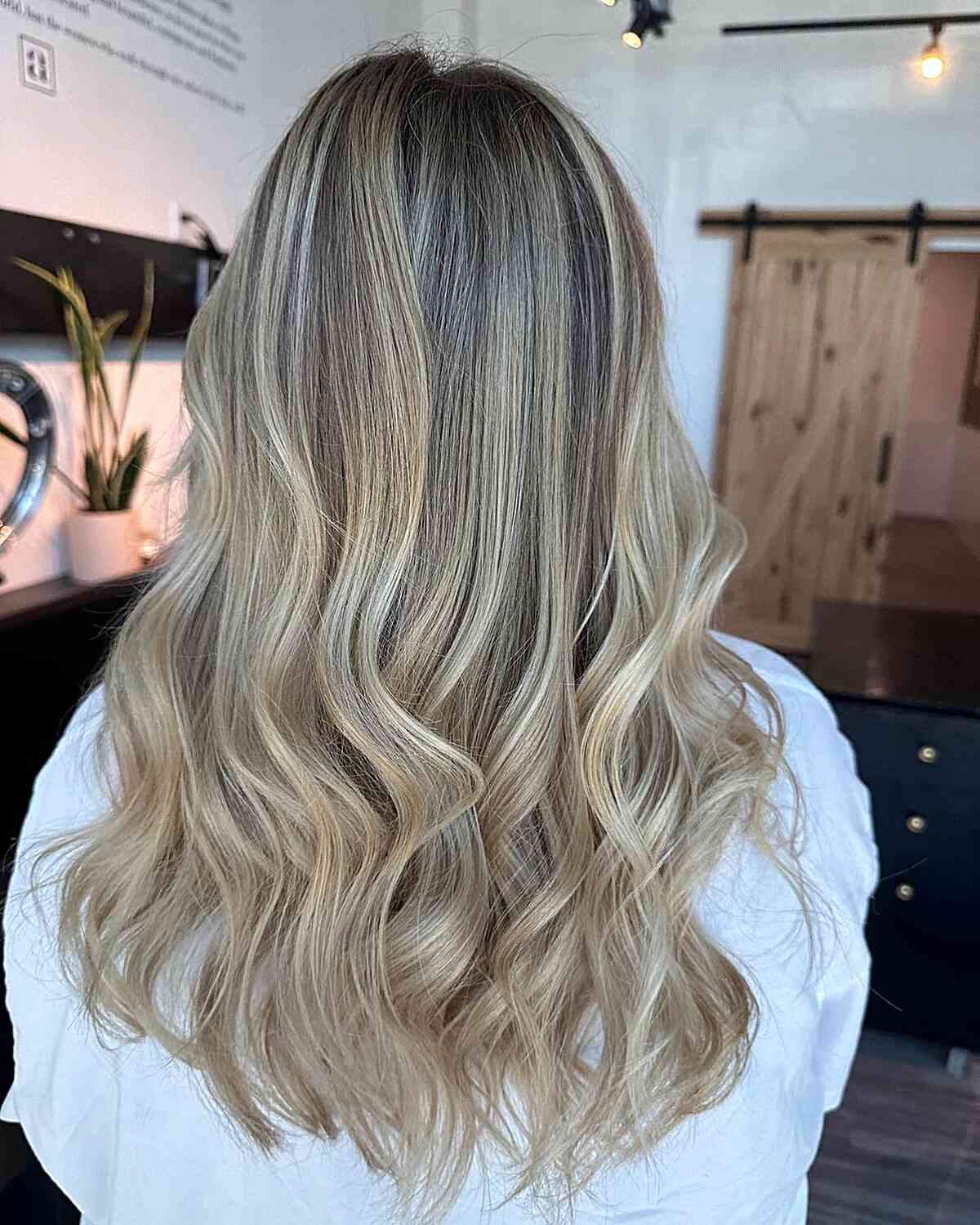 Dusted Trims for Mid-Back Rooted Wavy Blonde Hair