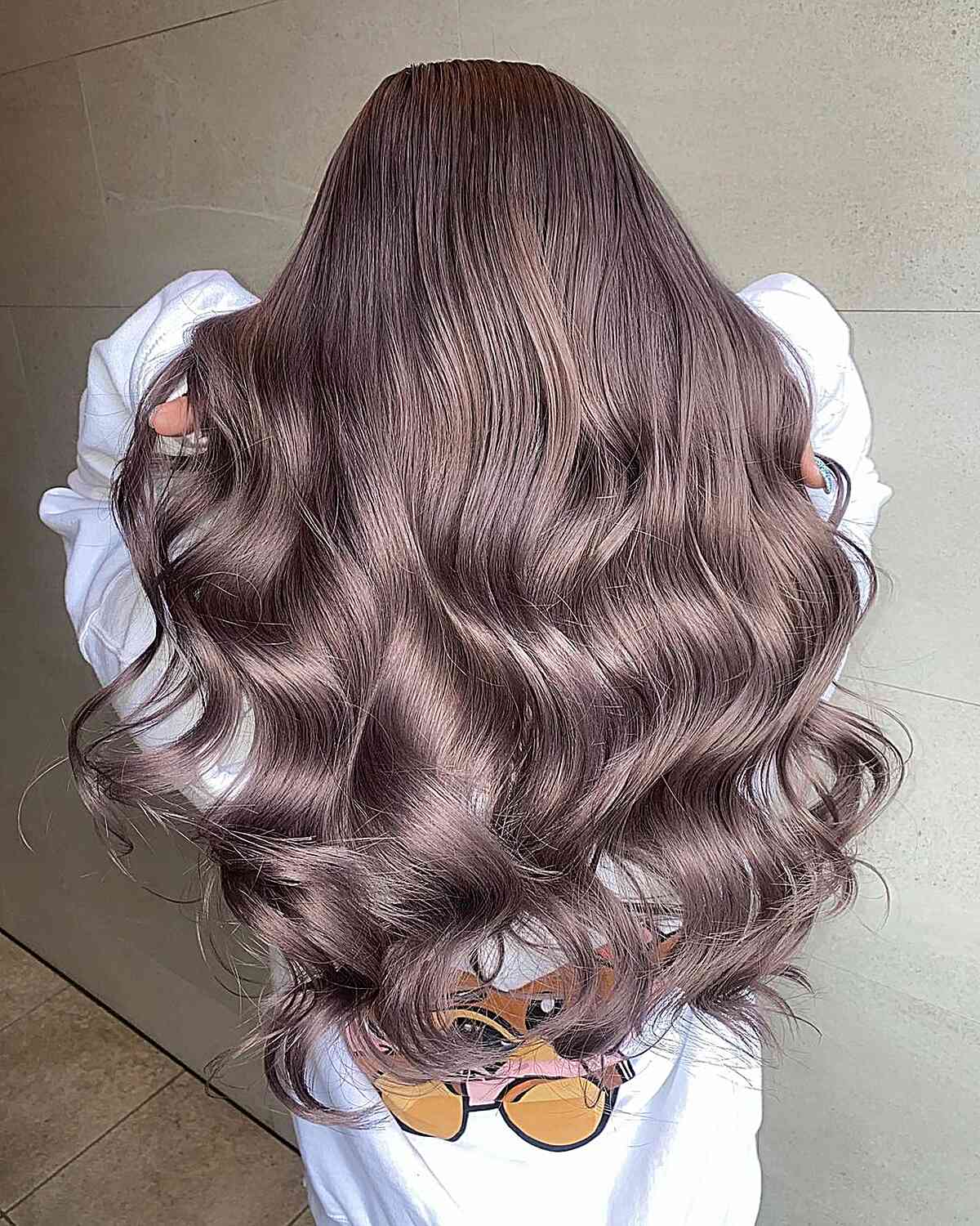 Dusty Brunette Balayage for women with long wavy hair