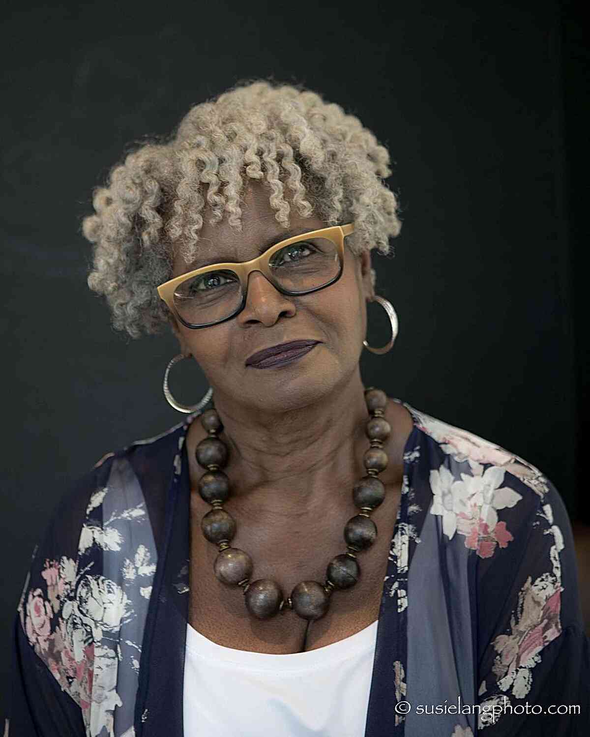 Ear-Length Mini Curly Bowl Cut with Layers for Older Black Women with Specs