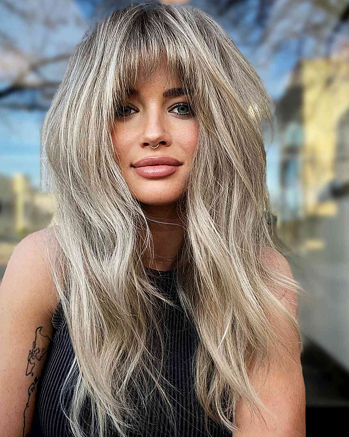 Earth-Toned Blonde with Bangs and Layers for Long Hair