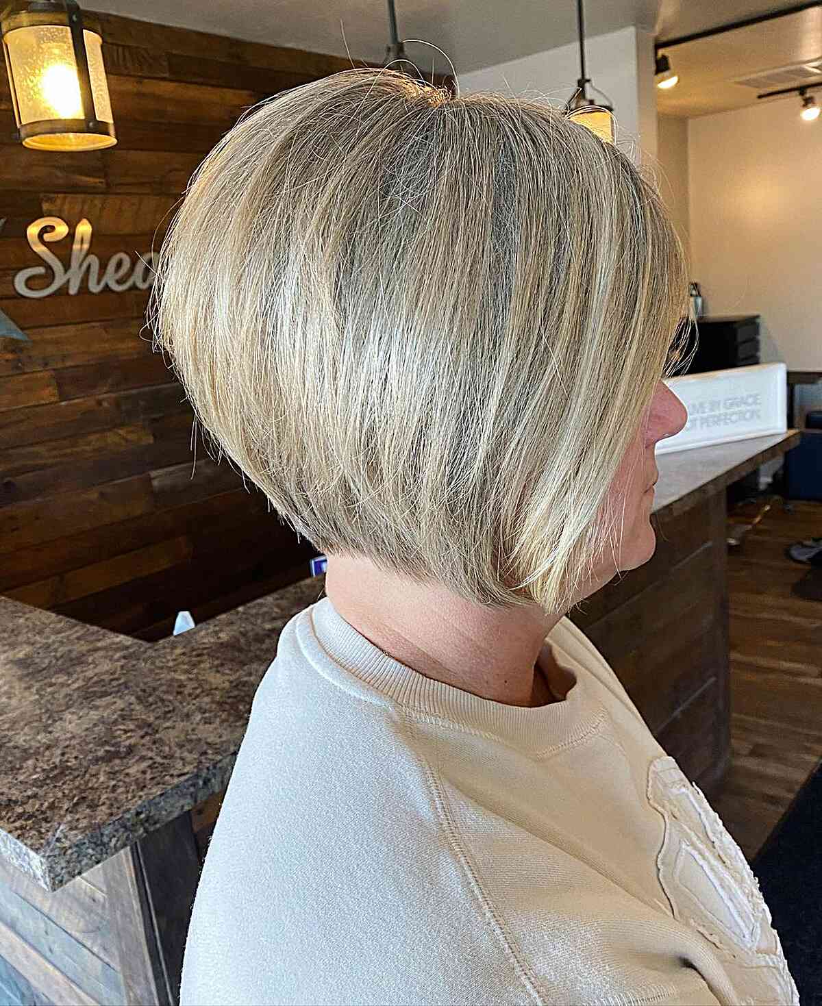 Earthy Blonde Tones on a Stacked Bob for women with short hair