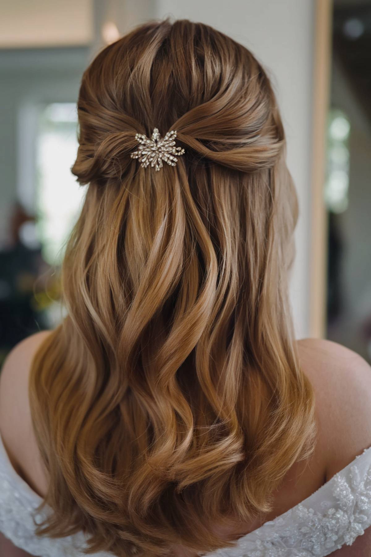 Soft half-up wedding hair with delicate embellishment