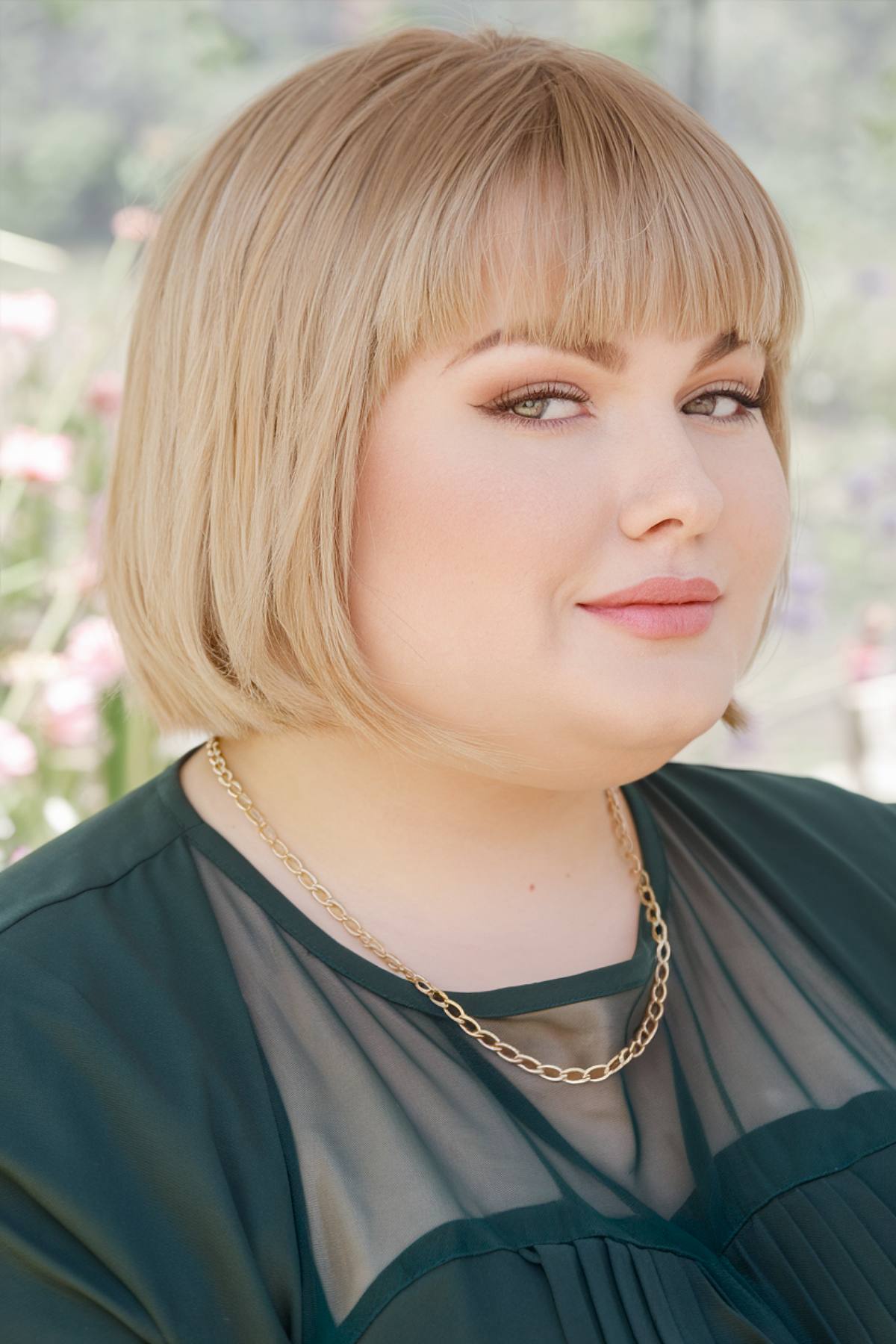 Straight short bob haircut with blunt ends for plus size women