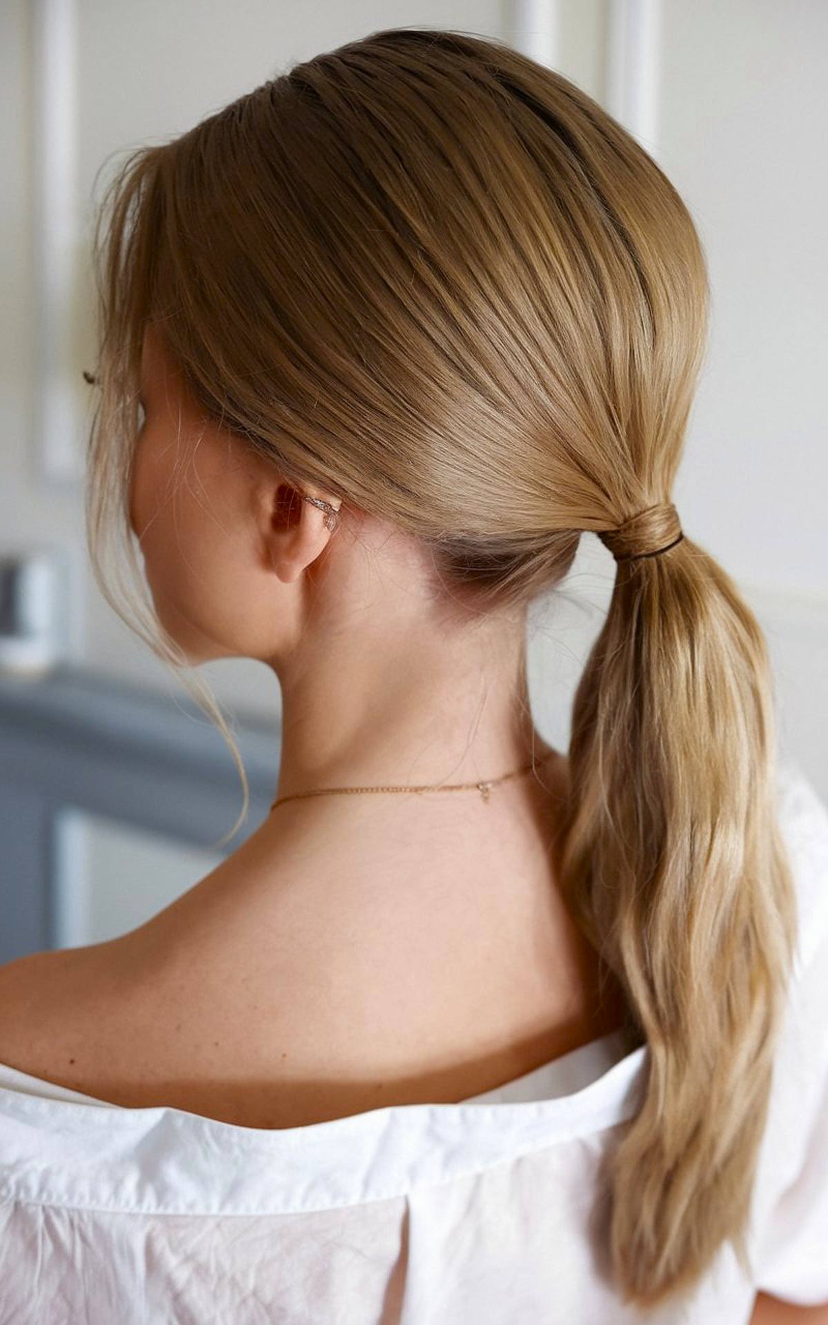 Easy work ponytail hairstyle for long hair with wrap-around tie