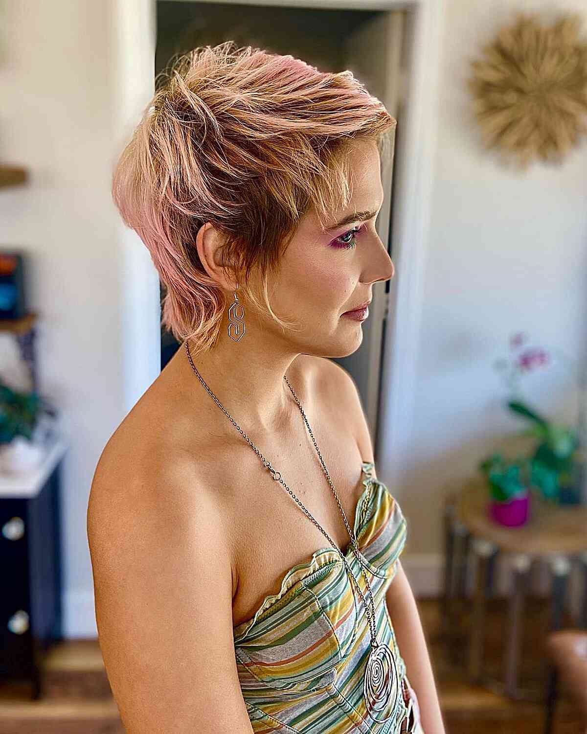 Edgy and Dimensional Layered Long Pixie Cut for women with pink hair and dark roots