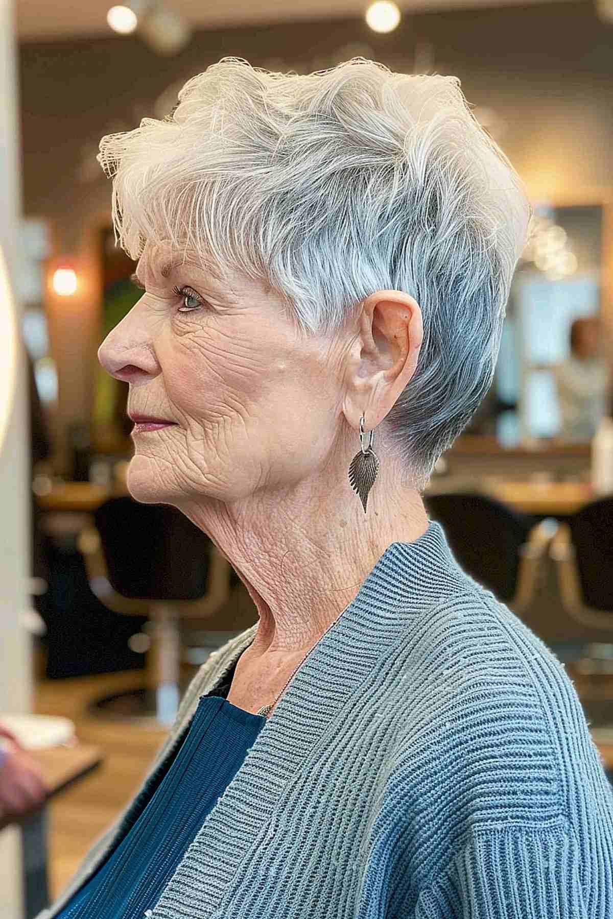 Edgy androgynous pixie with textured layers for women over 70, easy to style and adds volume to fine hair.