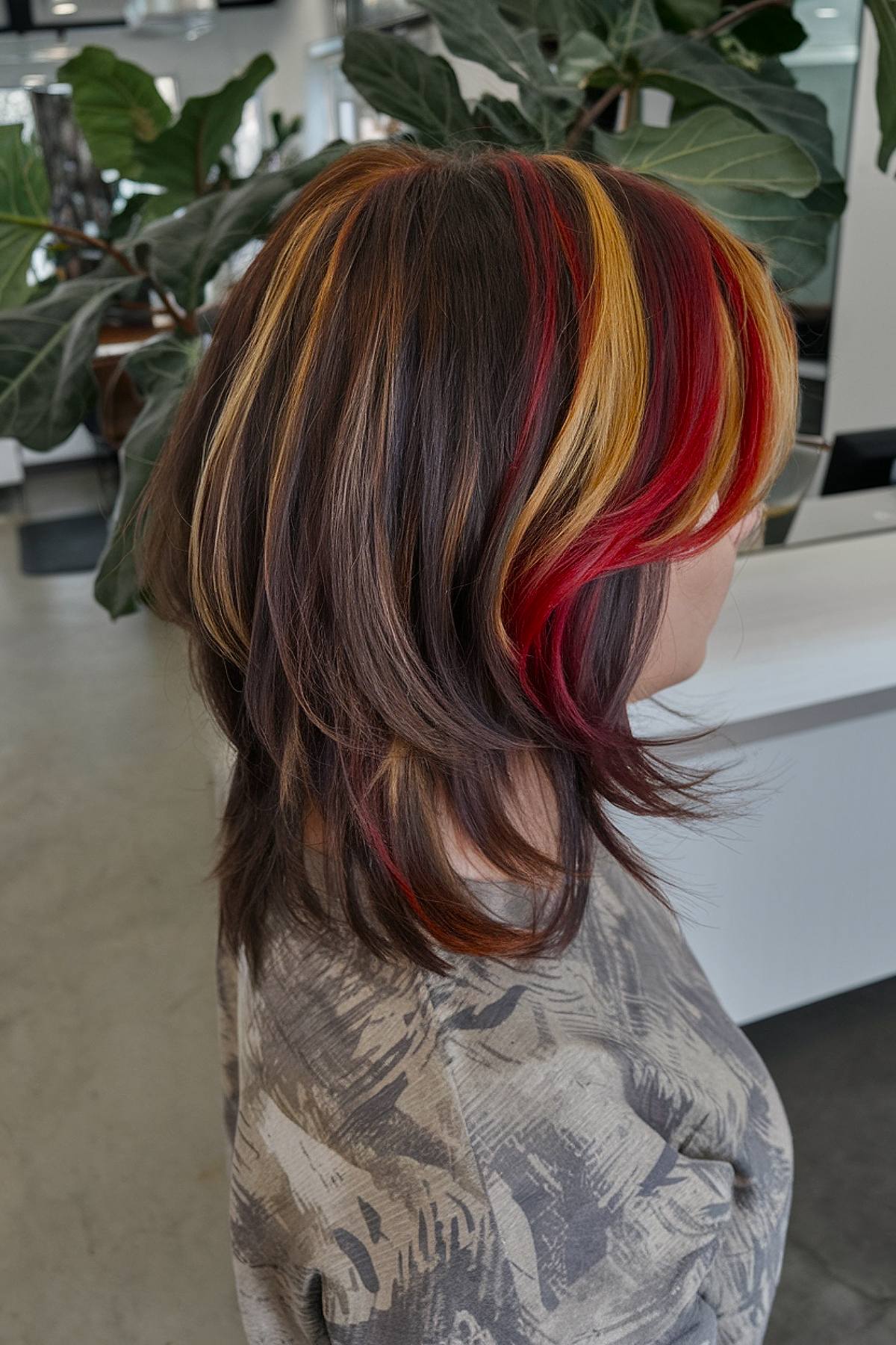 Edgy calico hair color with black, orange, and platinum