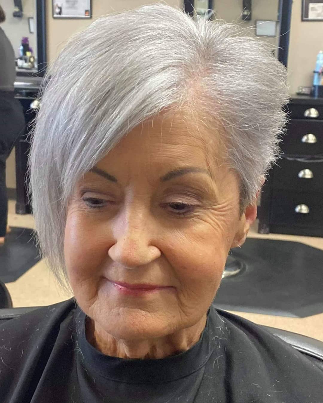 Edgy gray pixie cut with long bangs