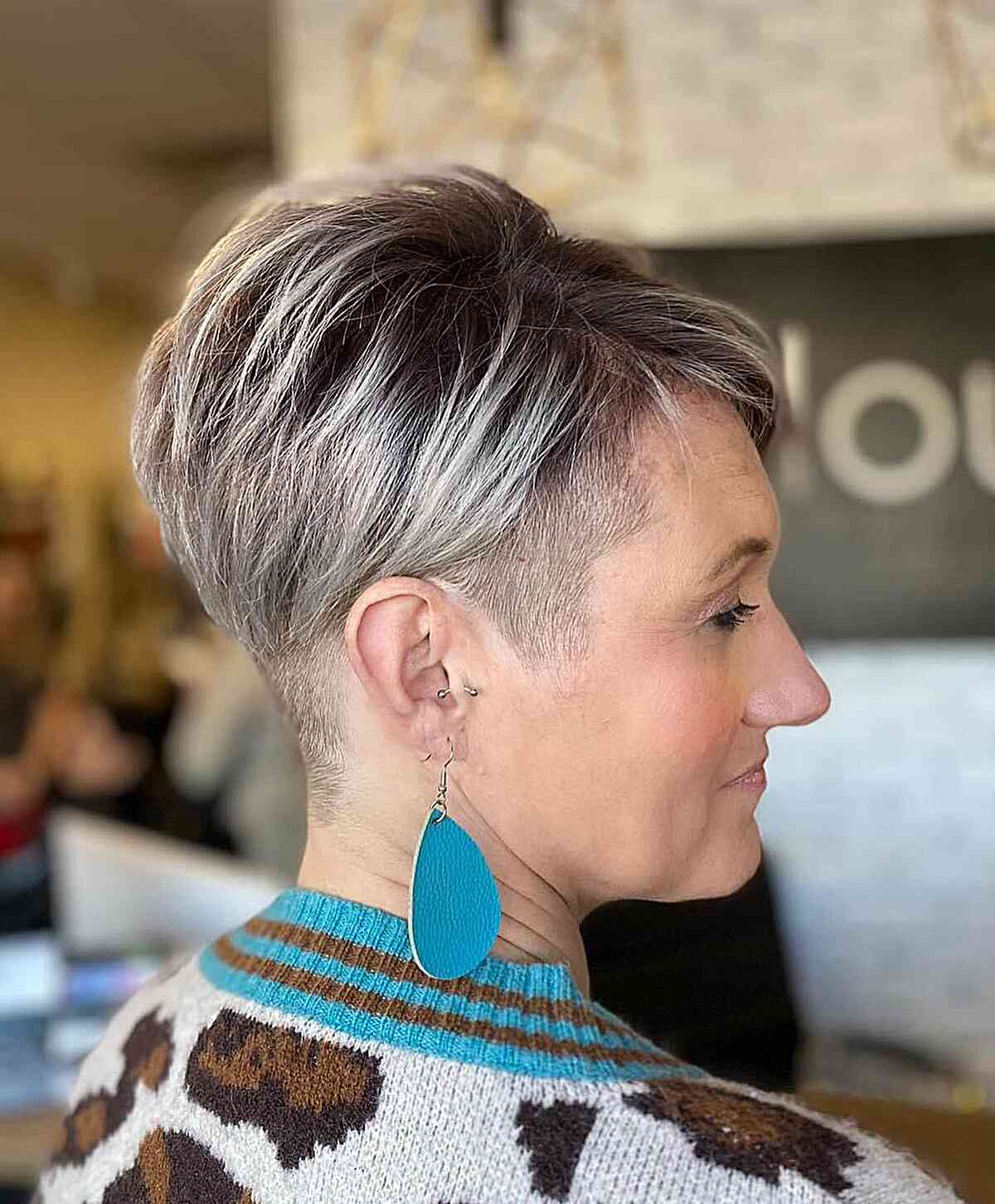 Edgy Pixie Cut with Short Choppy Layers and Shaved Sides and Nape