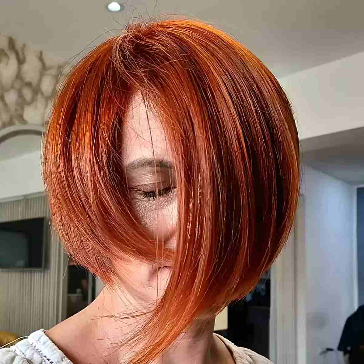 Short Edgy Red Orange Asymmetrical Fall Cut for Ladies Aged 60