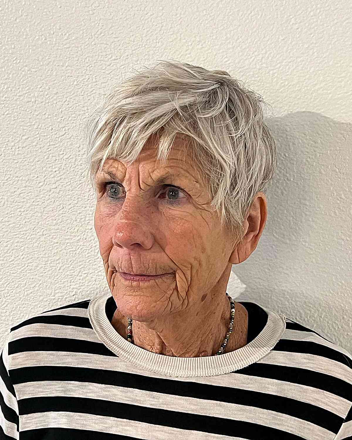 Edgy Tousled Pixie with Layers for 70-year-old Women with White Hair