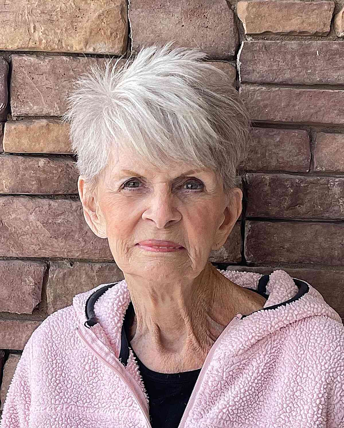 Edgy White Razored Layers with side-swept bangs for older women over 70
