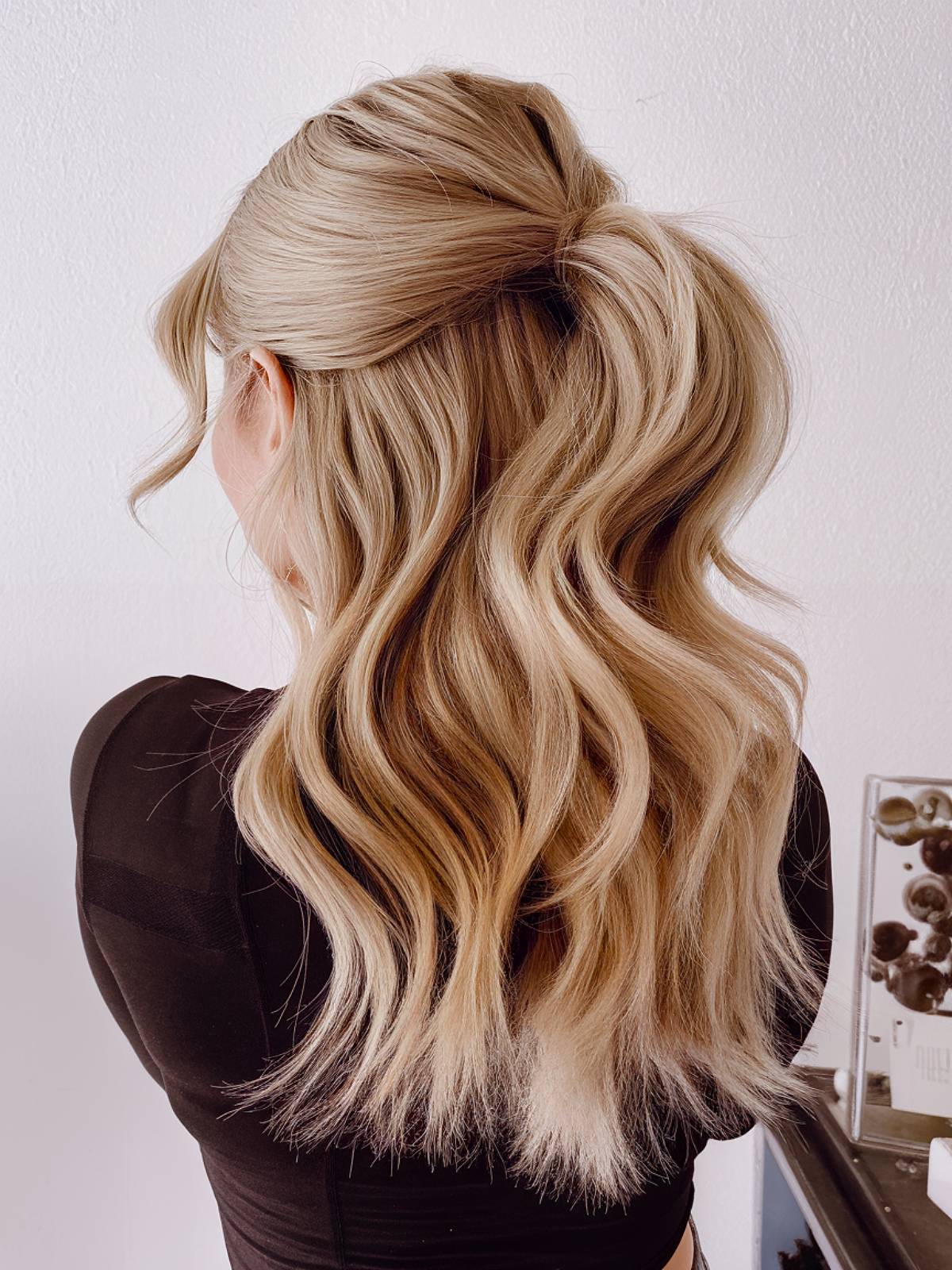 Effortless hairstyle featuring soft waves and a polished crown for easy styling