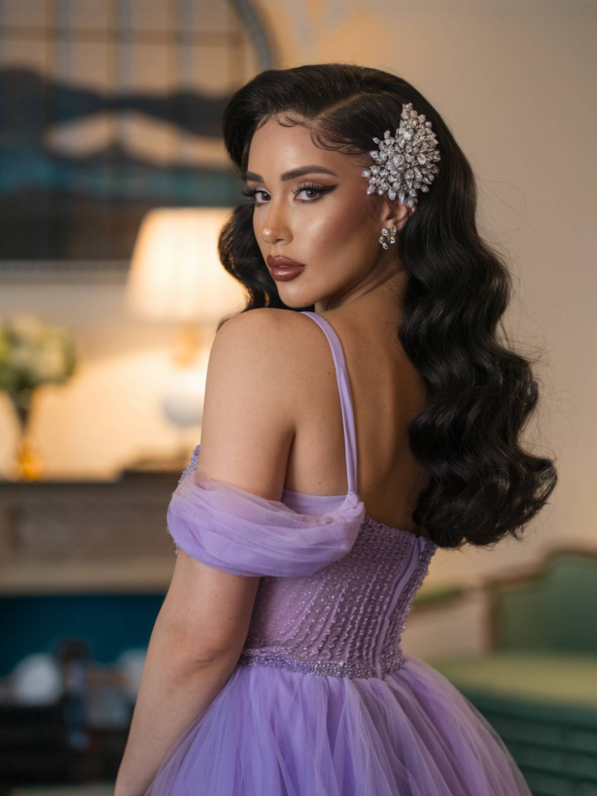 Glamorous vintage waves with deep side part and a jeweled hairpiece, a stunning Latina prom hairstyle