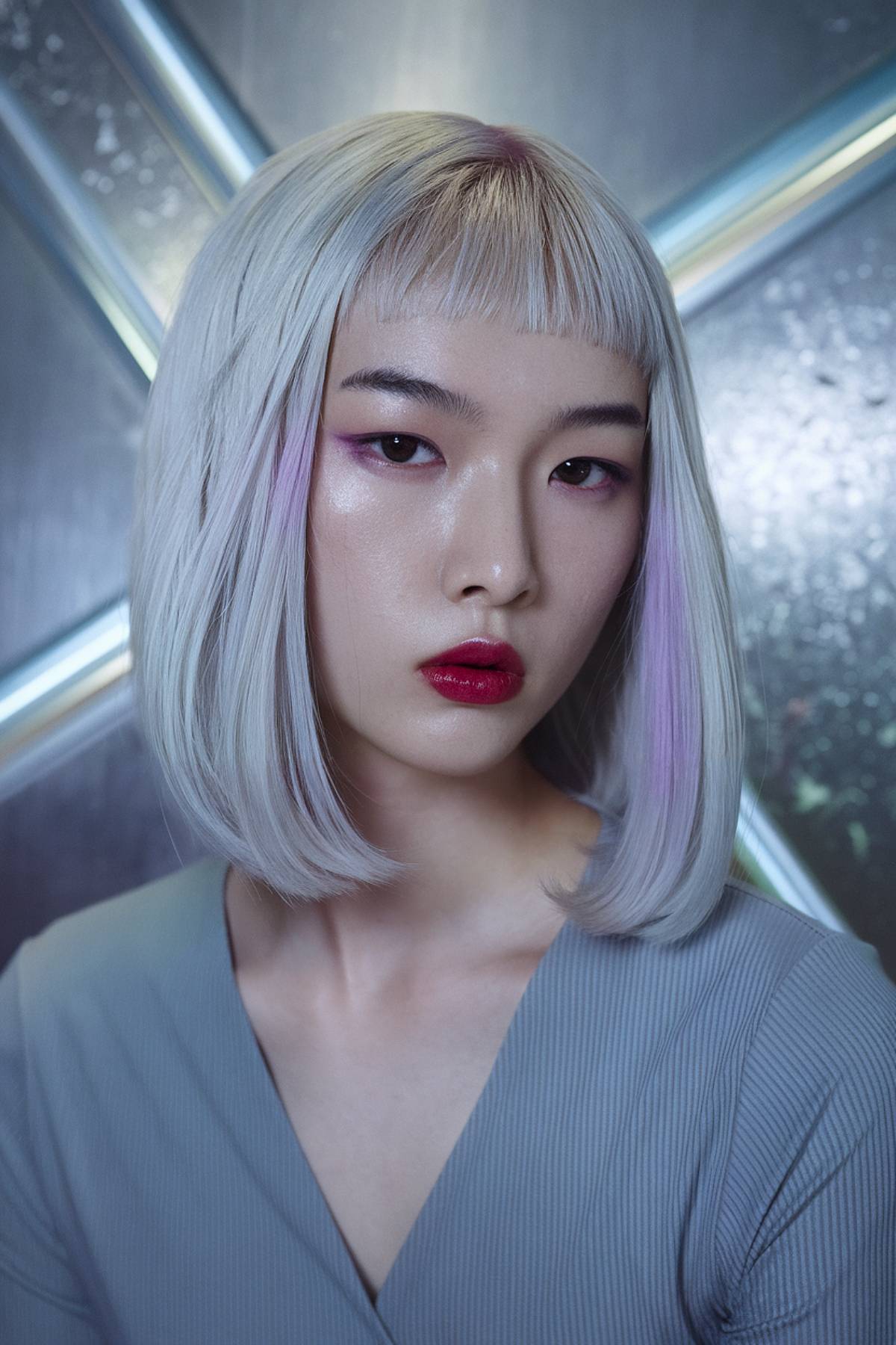 Ethereal shard bob with a sharp cut and icy platinum hair, featuring subtle violet reflections