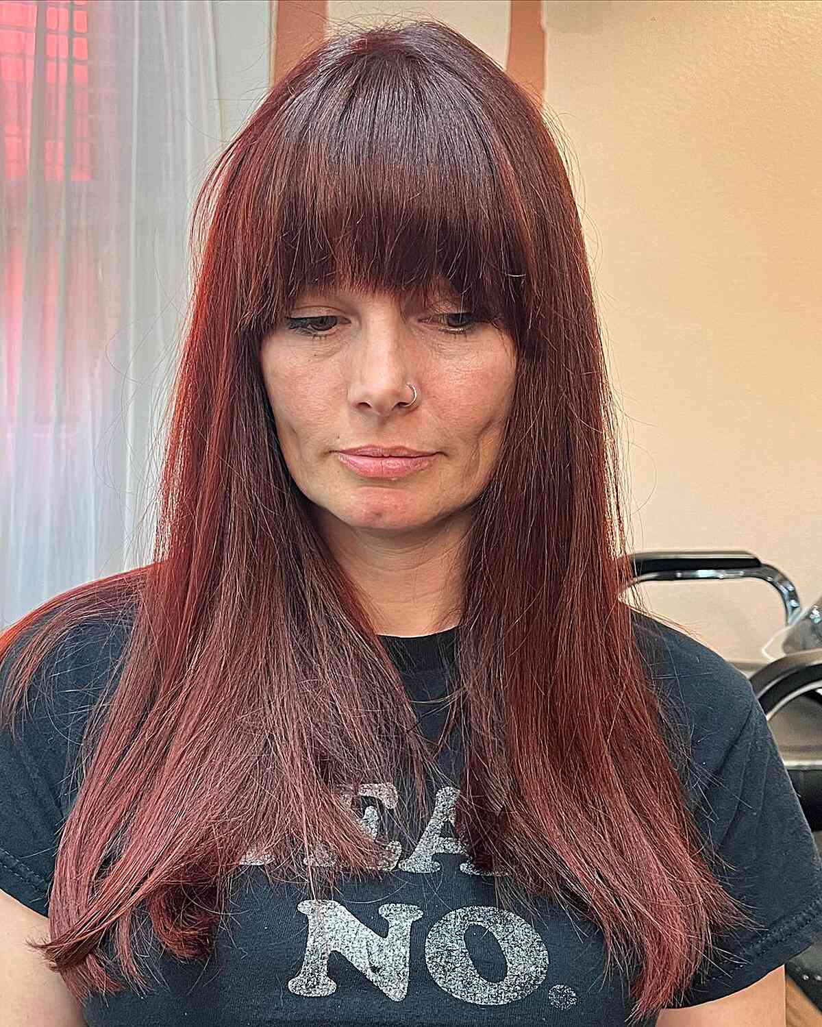 Eye-Grazing Fringe for Straight and Long Dark Red Hair on Older Ladies Aged 50