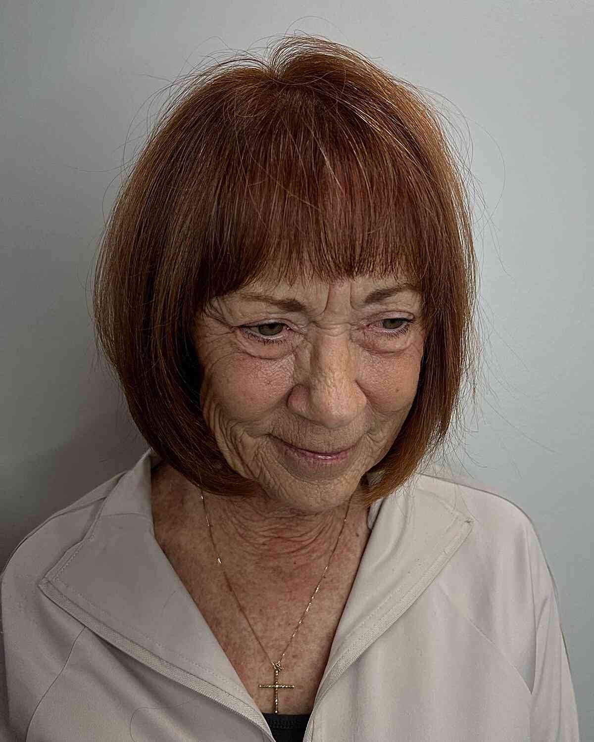 Face-Framing Chin-Length Bob with Soft Layers and Full Bangs for Women Over 70