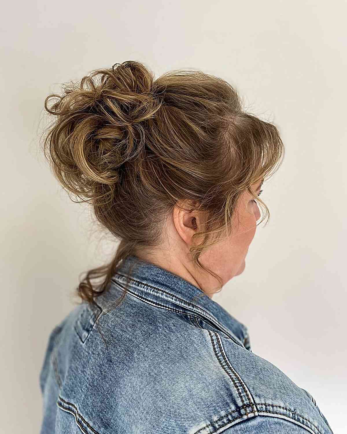 Face-Framing High Loose Knot Hairstyle for Older Wedding Guests