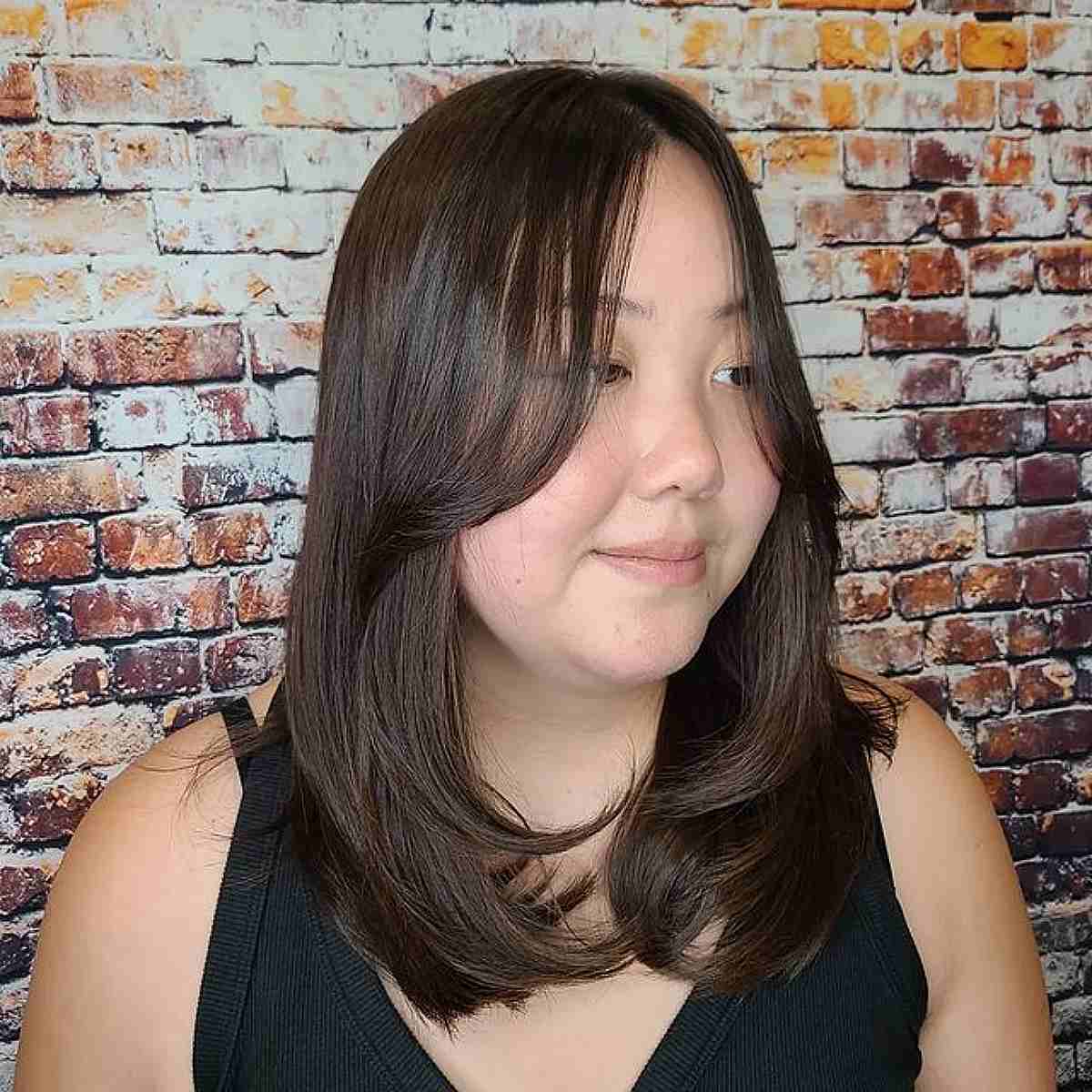 Face-Framing Layers and Long CurtainBangs for Straight Fine Hair