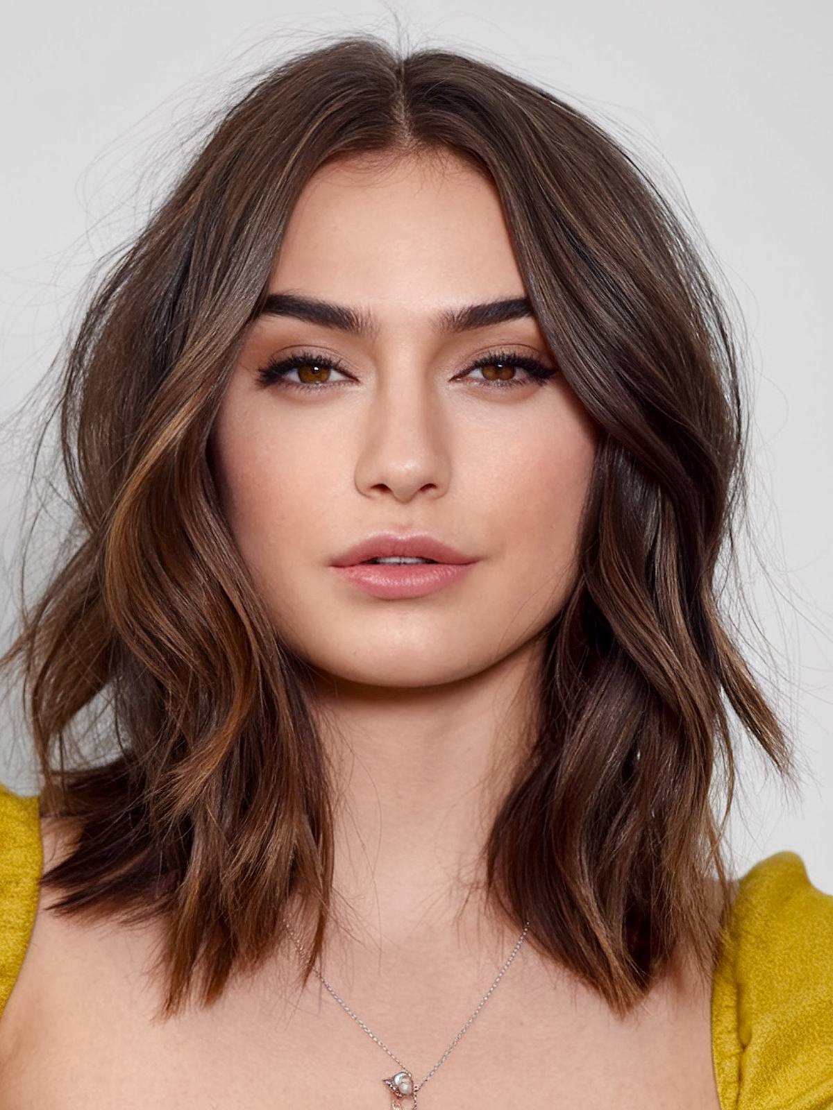 Shoulder-length haircut with face-framing layers