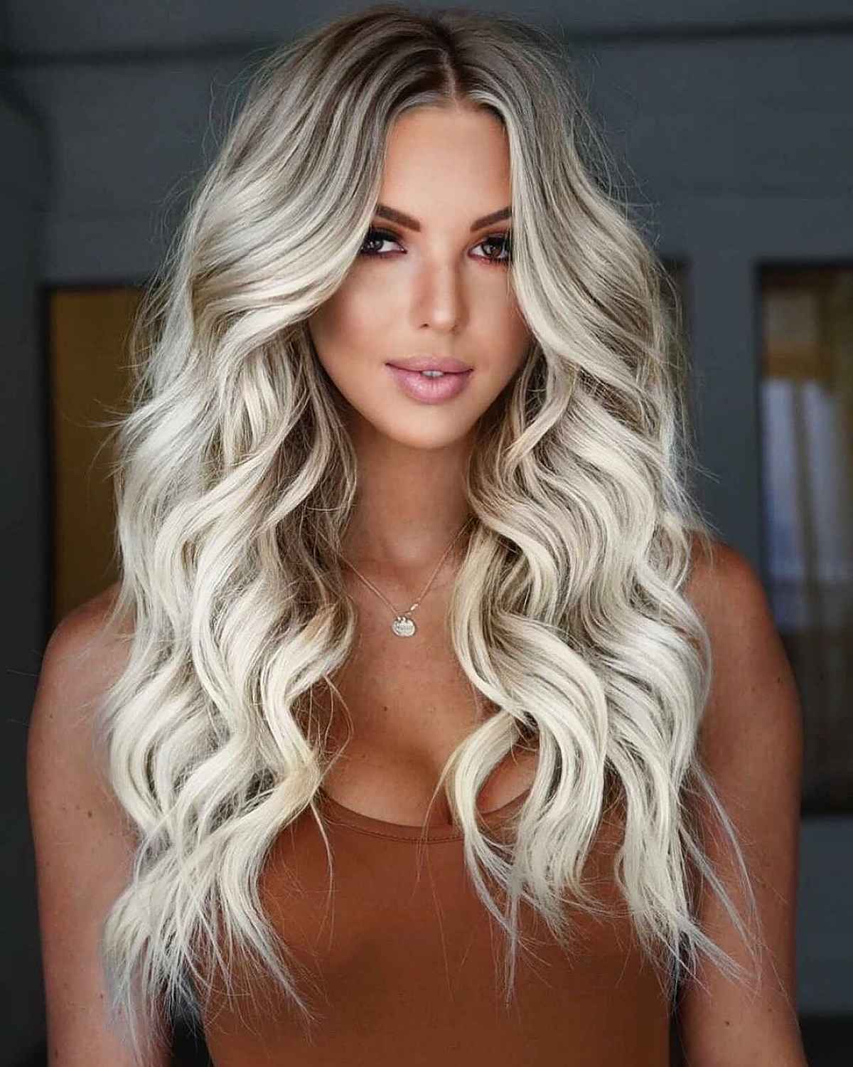 face-framing long blonde layered hairstyle