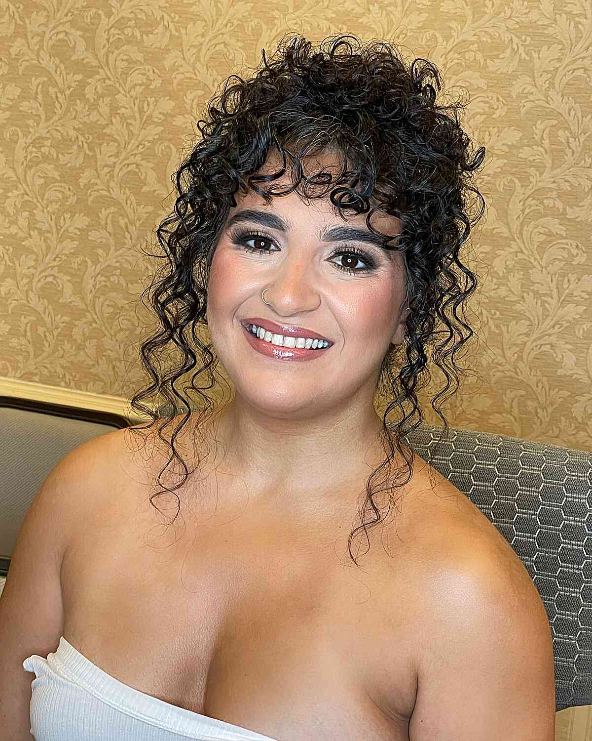 Face-Framing Updo with Curly Bangs