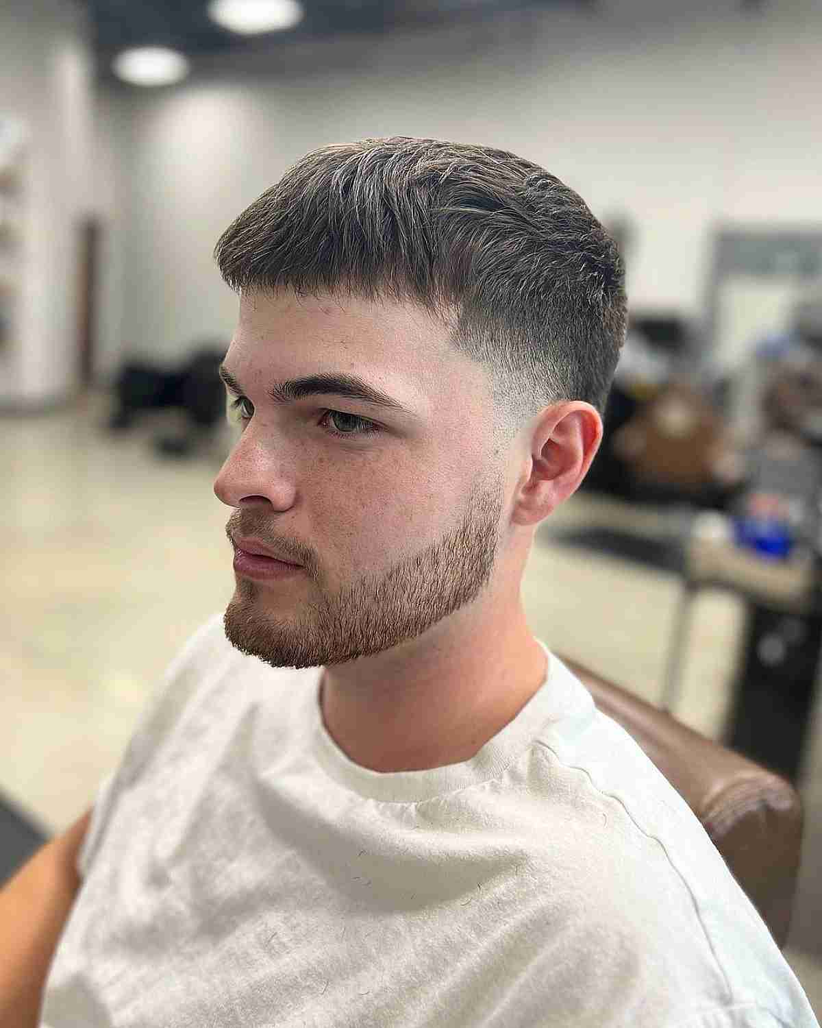 Faded Haircut with Short Fringe and Low Taper